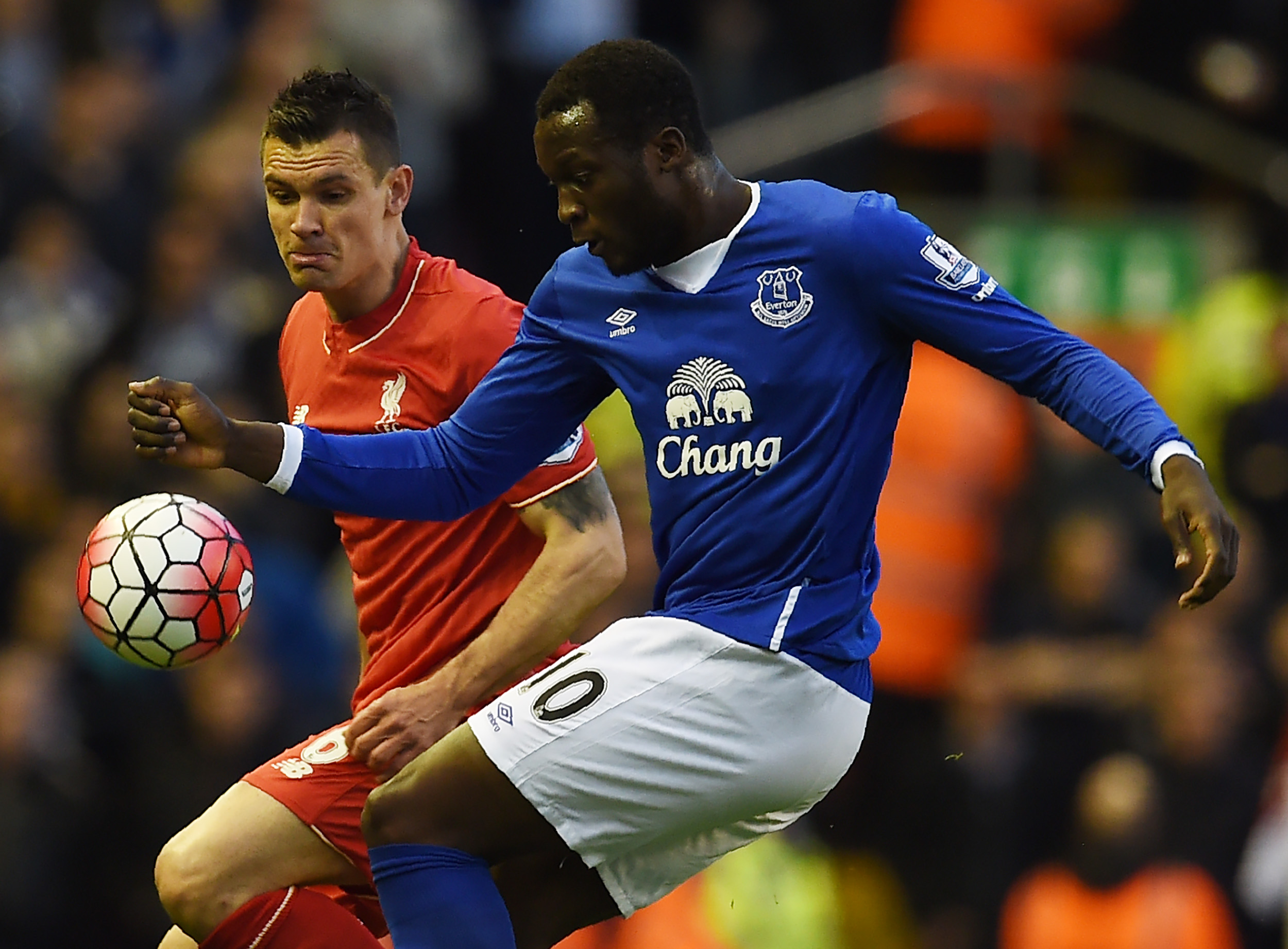 Liverpool's Croatian defender Dejan Lovren (L) vies with Everton's Belgian striker Romelu Lukaku during the English Premier League football match between Liverpool and Everton at Anfield in Liverpool, north west England on April 20, 2016. / AFP / PAUL ELLIS / RESTRICTED TO EDITORIAL USE. No use with unauthorized audio, video, data, fixture lists, club/league logos or 'live' services. Online in-match use limited to 75 images, no video emulation. No use in betting, games or single club/league/player publications.  /         (Photo credit should read PAUL ELLIS/AFP/Getty Images)