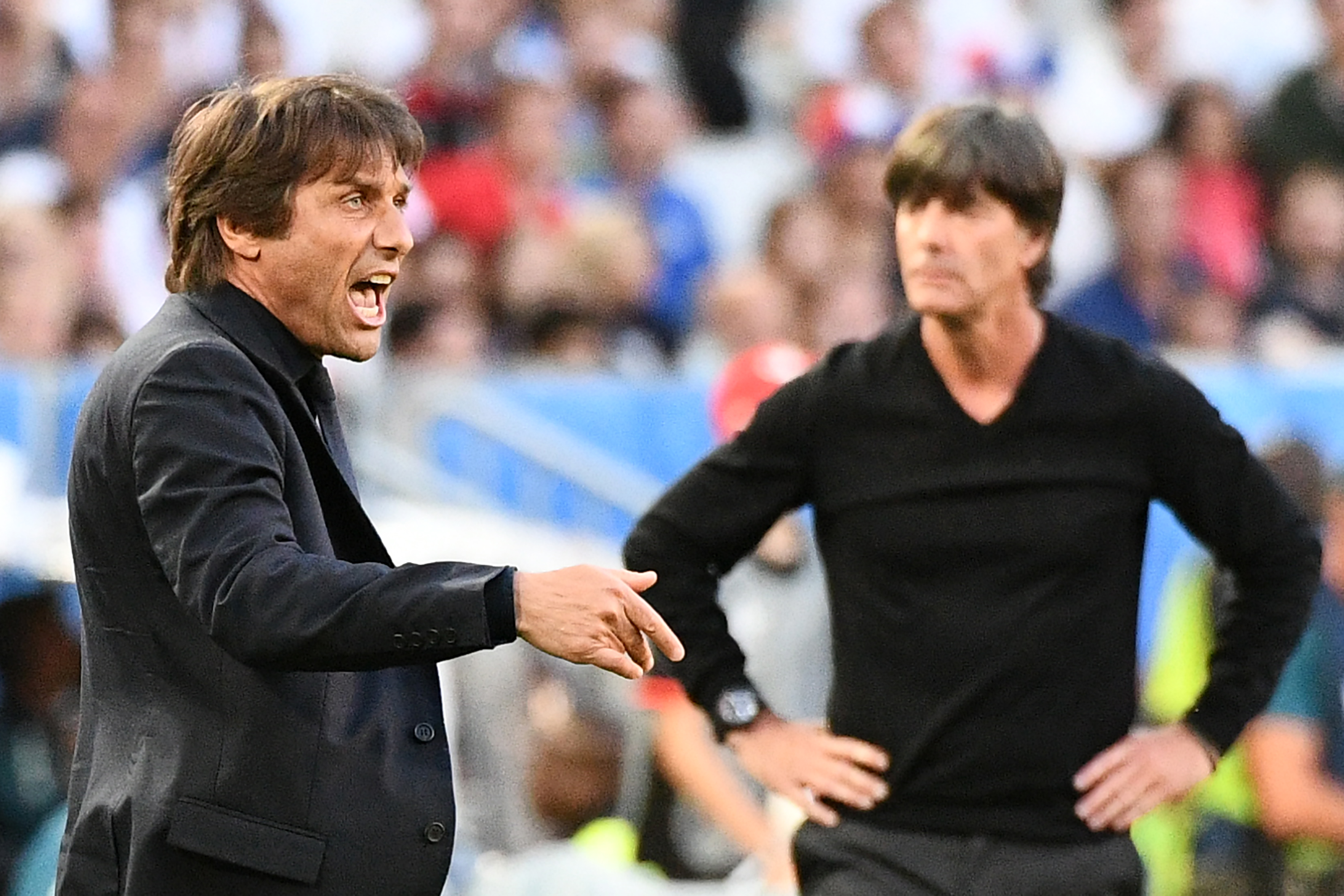 Italy's coach Antonio Conte (L) reacts as Germany's coach Joachim Loew (R) looks on during the Euro 2016 quarter-final football match between Germany and Italy at the Matmut Atlantique stadium in Bordeaux on July 2, 2016.
 / AFP / VINCENZO PINTO        (Photo credit should read VINCENZO PINTO/AFP/Getty Images)