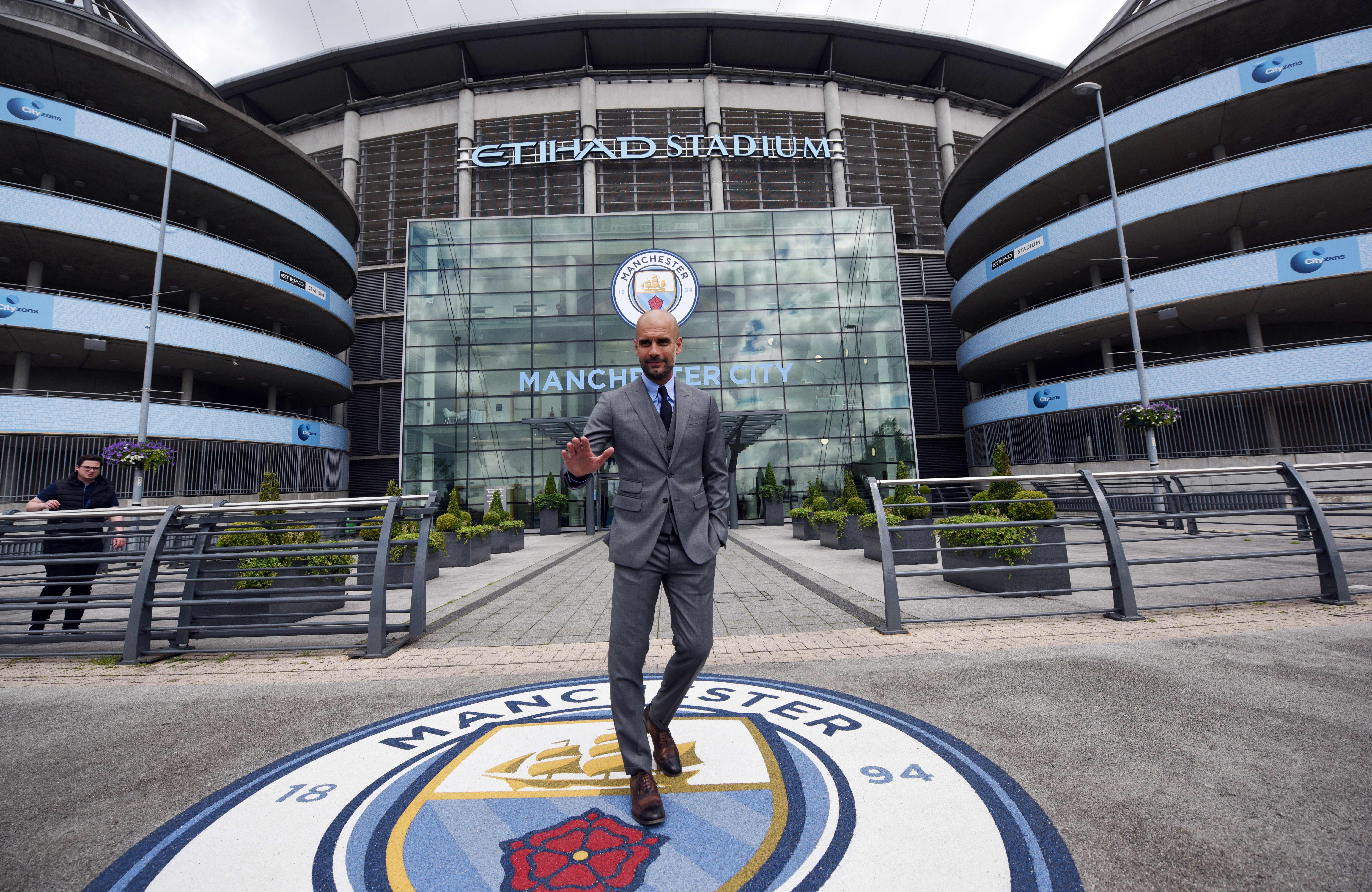 Manchester City's Spanish football coach Pep Guardiola poses for photographs outside the Etihad Stadium in Manchester, northern England, on July 8, 2016.

Pep Guardiola has warned his Manchester City players that they have to prove themselves all over again following his arrival at the club. / AFP / OLI SCARFF / RESTRICTED TO EDITORIAL USE. NO USE WITH UNAUTHORIZED AUDIO, VIDEO, DATA, FIXTURE LISTS, CLUB/LEAGUE LOGOS OR "LIVE" SERVICES. ONLINE IN-MATCH USE LIMITED TO 45 IMAGES, NO VIDEO EMULATION. NO USE IN BETTING, GAMES OR SINGLE CLUB/LEAGUE/PLAYER PUBLICATIONS.        (Photo credit should read OLI SCARFF/AFP/Getty Images)