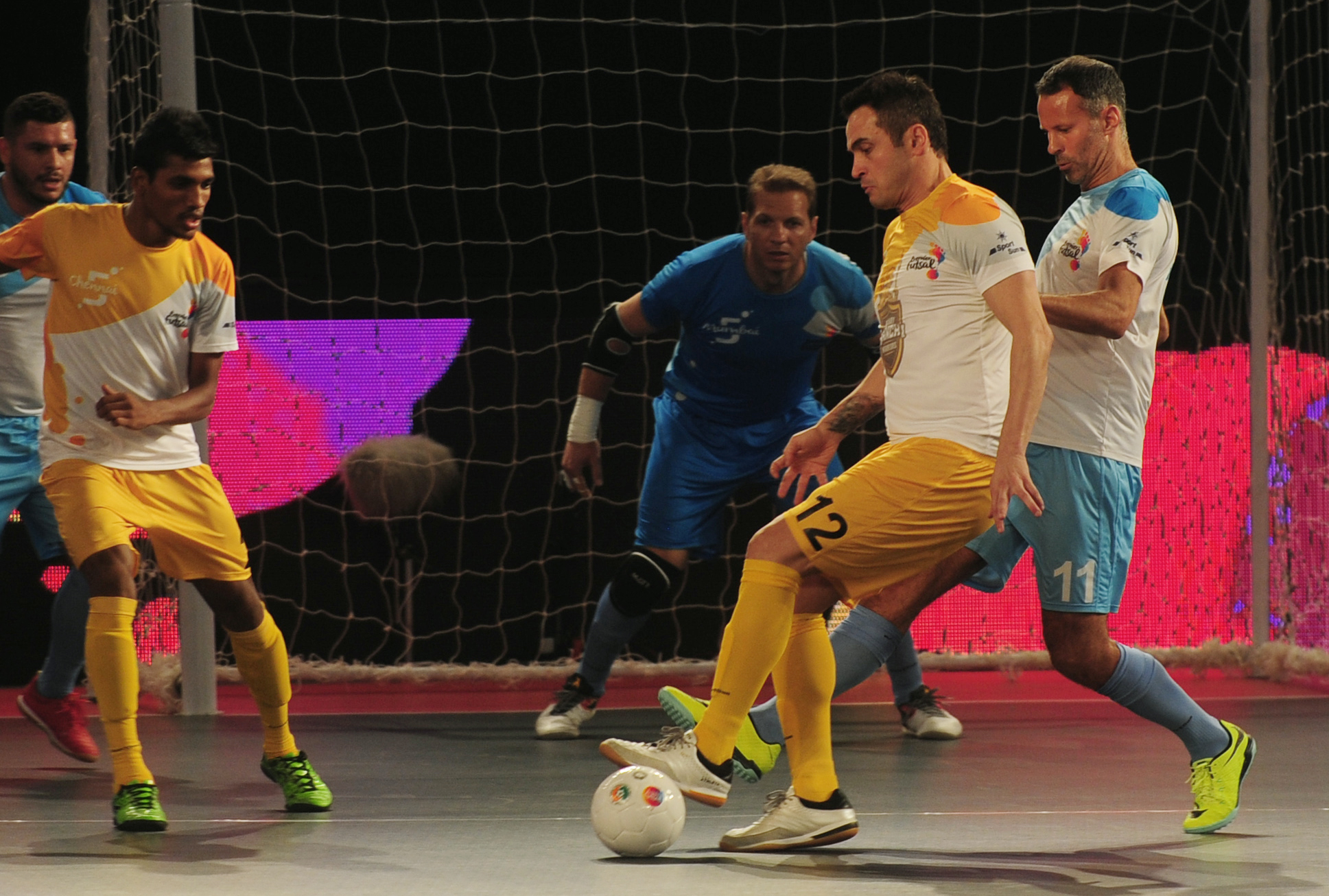 Alessandro Rosa Viera (2R), also known as Falcao, from the Chennai 5's plays against the Mumbai 5's during their Premier Futsal Football League match in Chennai on July 15, 2016. / AFP / ARUN SANKAR        (Photo credit should read ARUN SANKAR/AFP/Getty Images)