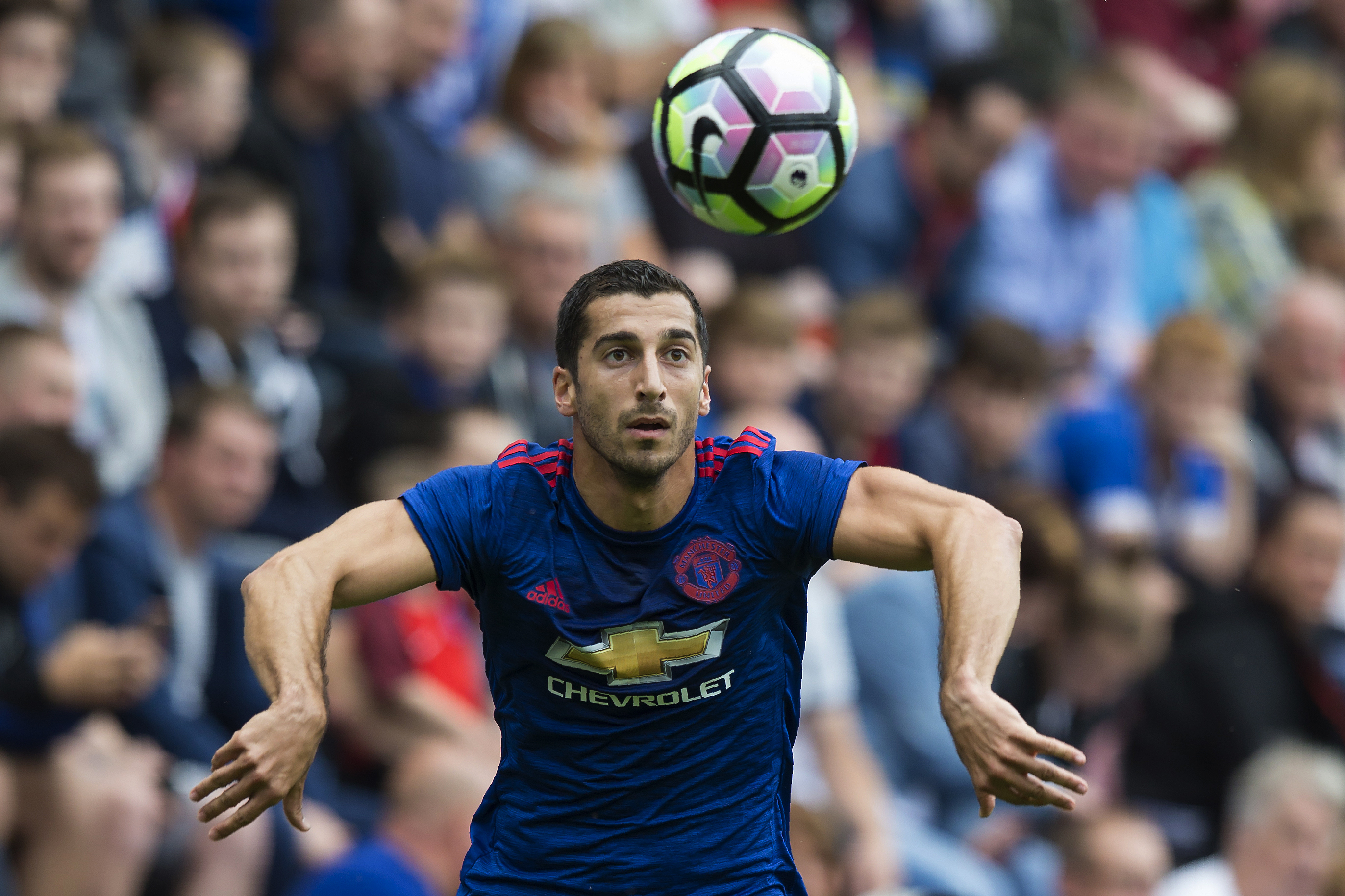 Manchester United's Armenian midfielder Henrikh Mkhitaryan controls the ball during the pre-season friendly football match between Wigan Athletic and Manchester United at the DW stadium in Wigan, northwest England, on July 16, 2016.  / AFP / JON SUPER / RESTRICTED TO EDITORIAL USE. No use with unauthorized audio, video, data, fixture lists, club/league logos or 'live' services. Online in-match use limited to 75 images, no video emulation. No use in betting, games or single club/league/player publications.  /         (Photo credit should read JON SUPER/AFP/Getty Images)