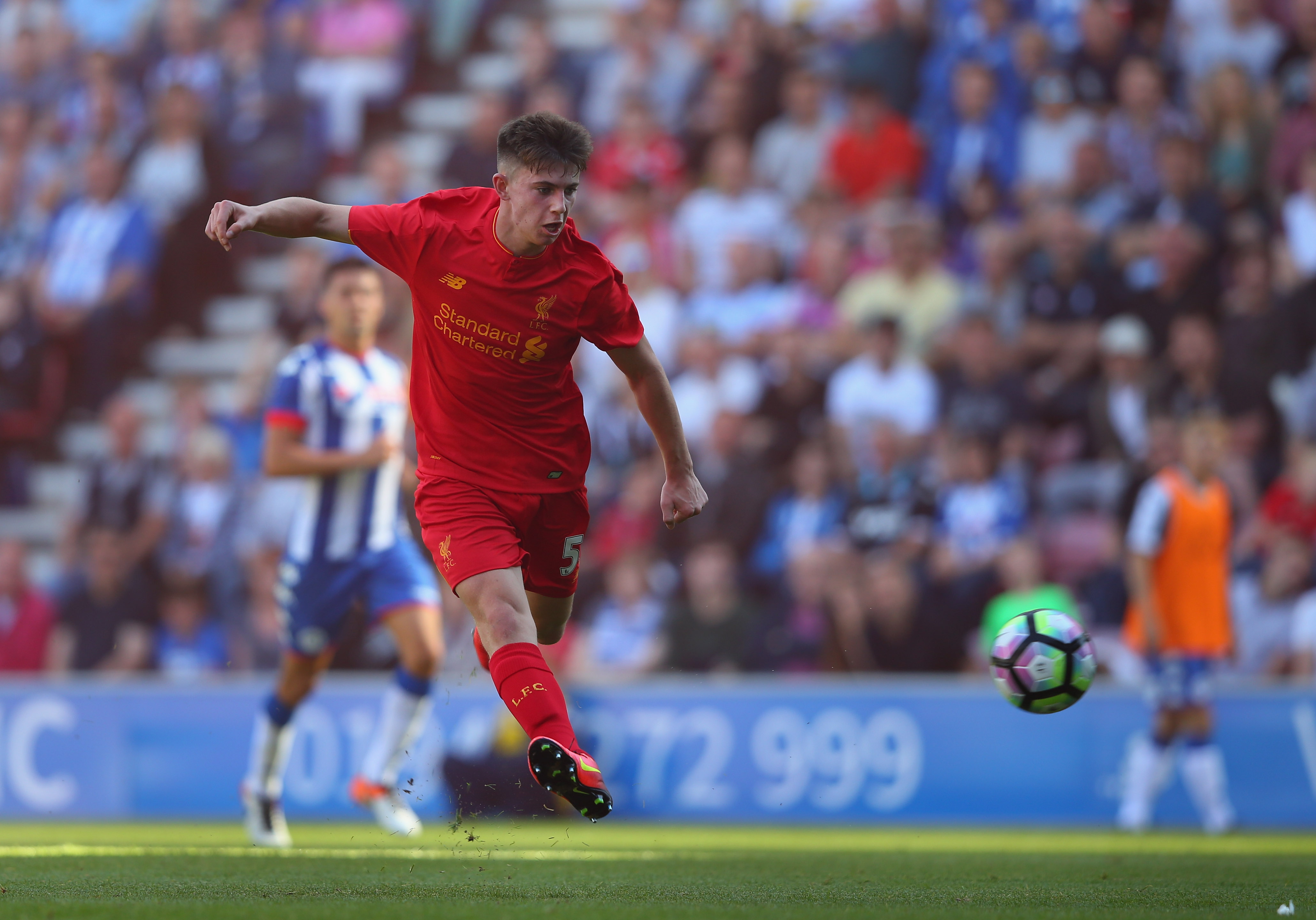 WIGAN, ENGLAND - JULY 17:  Ben Woodburn of Liverpool scores the second goal during a pre-season friendly between Wigan Athletic and Liverpool at JJB Stadium on July 17, 2016 in Wigan, England.  (Photo by Alex Livesey/Getty Images)