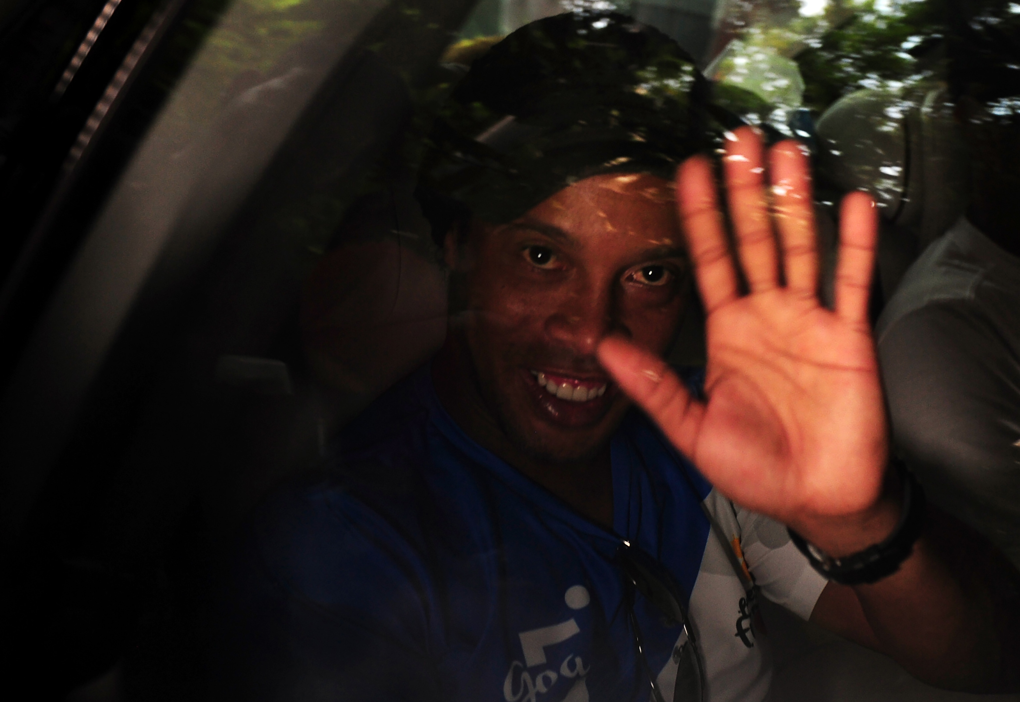 Former Brazilian footballer Ronaldhino leaves a media briefing of the Premier Futsal Football League in Chennai on July 14, 2016. / AFP / ARUN SANKAR        (Photo credit should read ARUN SANKAR/AFP/Getty Images)