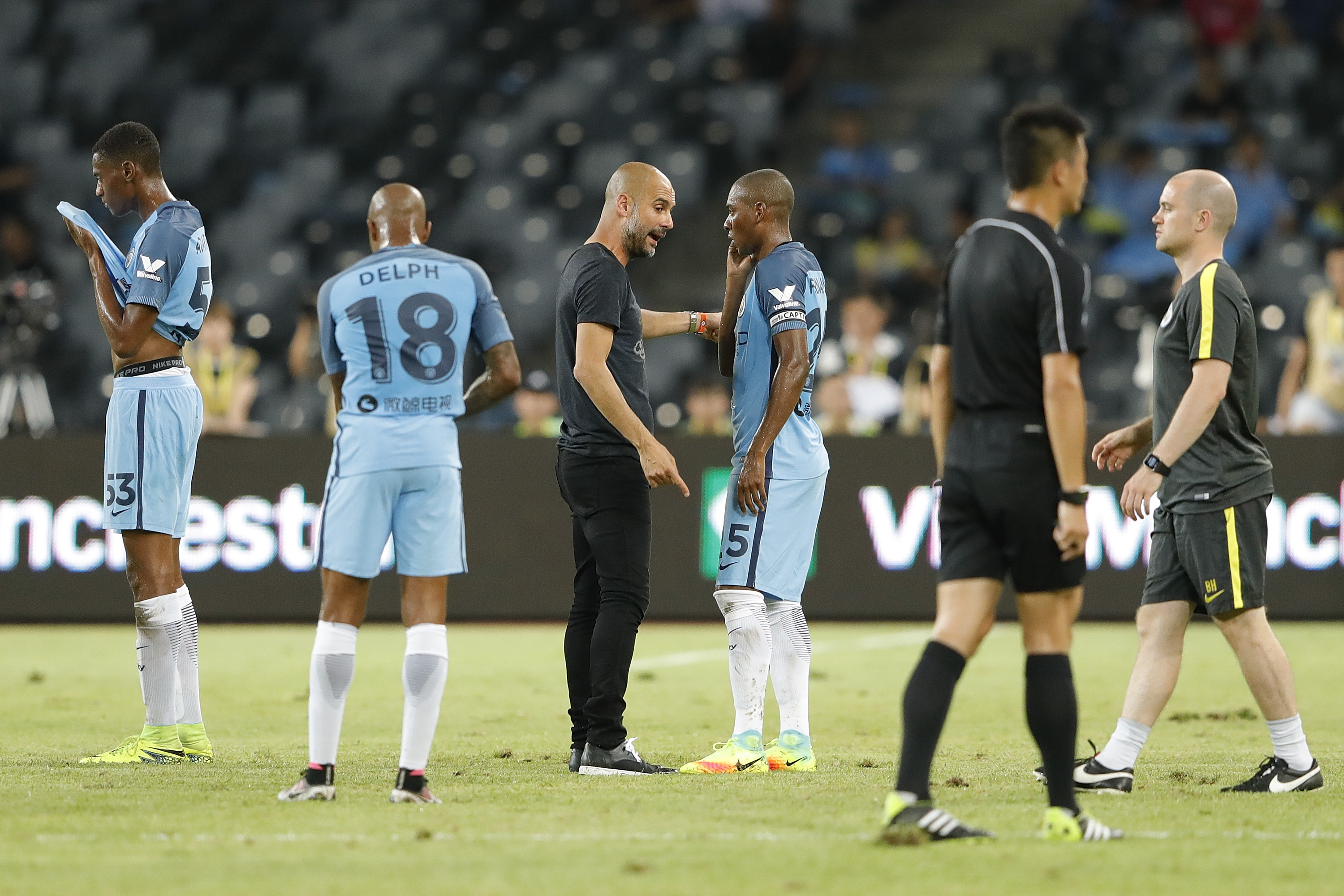 SHENZHEN, CHINA - JULY 28:  Manchester City's manager Pep Guardiola talk with Fernandinho during the 2016 International Champions Cup match between Manchester City and Borussia Dortmund at Shenzhen Universiade Stadium on July 28, 2016 in Shenzhen, China.  (Photo by Lintao Zhang/Getty Images)