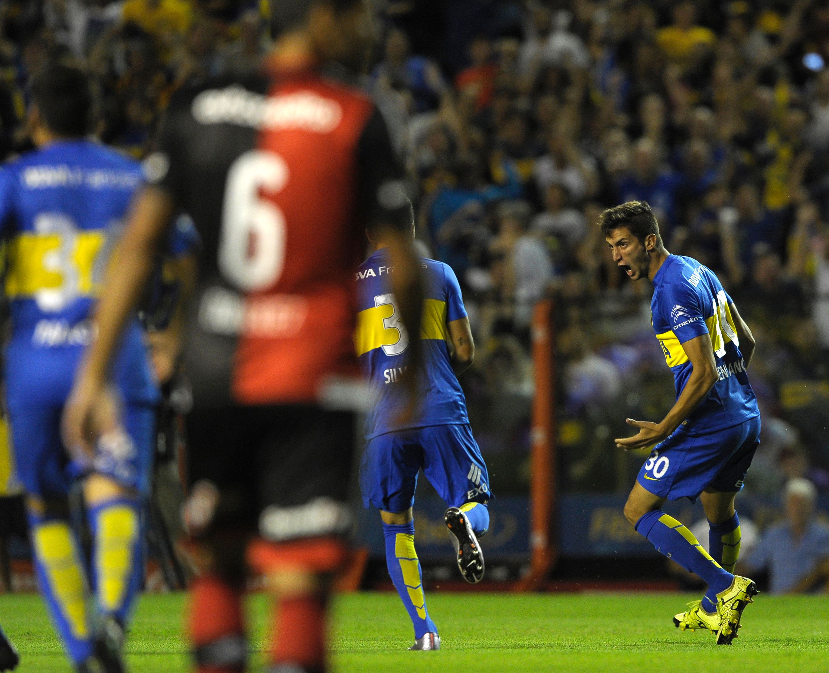 Boca's footballer Rodrigo Bentancur (R) celebrates with teammates after scoring against Newells during their Argentina First Division football match at La Bombonera stadium, in Buenos Aires, Argentina, on February 20, 2016. AFP PHOTO / ALEJANDRO PAGNI / AFP / ALEJANDRO PAGNI        (Photo credit should read ALEJANDRO PAGNI/AFP/Getty Images)