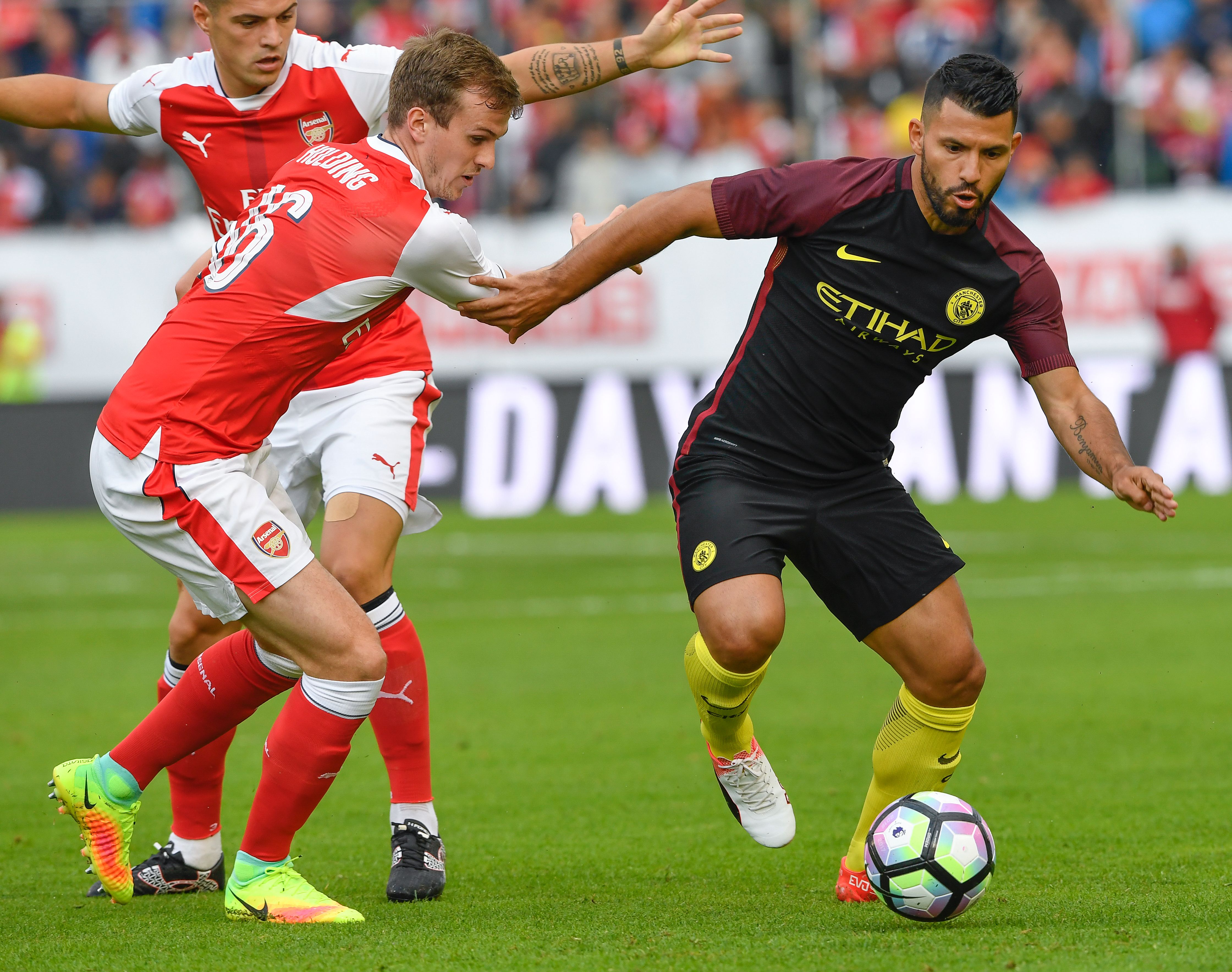 Arsenal's English defender Rob Holding (L) vies with Manchester City's Argentinian forward Sergio Aguero during the friendly football match between Arsenal and Manchester City at the Ullevi stadium in Gothenburg on August 7, 2016. / AFP / JONATHAN NACKSTRAND        (Photo credit should read JONATHAN NACKSTRAND/AFP/Getty Images)