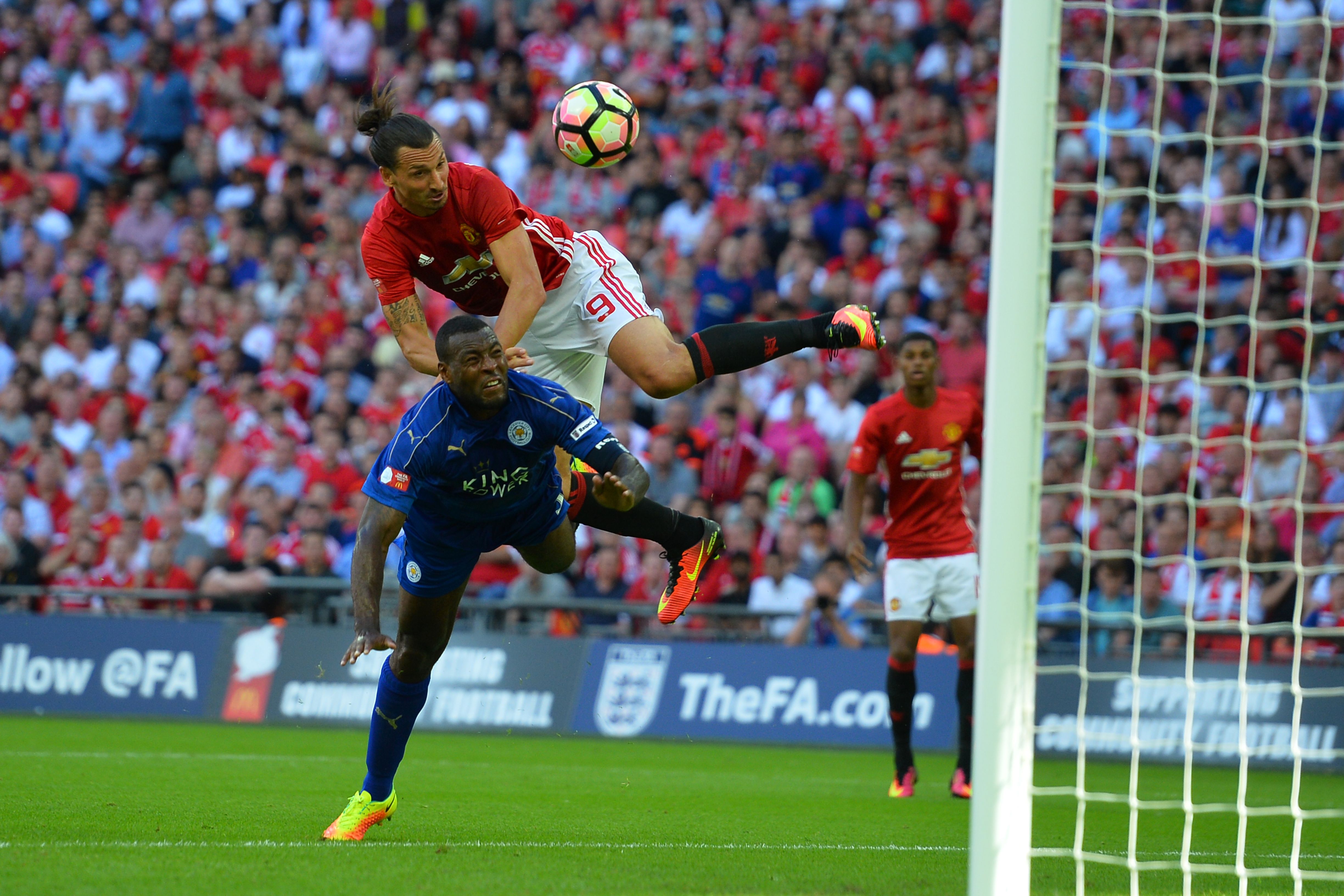 Wes Morgan was outdone by Zlatan as he towered above the strong defender to slot home United's winner. (Picture Courtesy - AFP/Getty Images)
