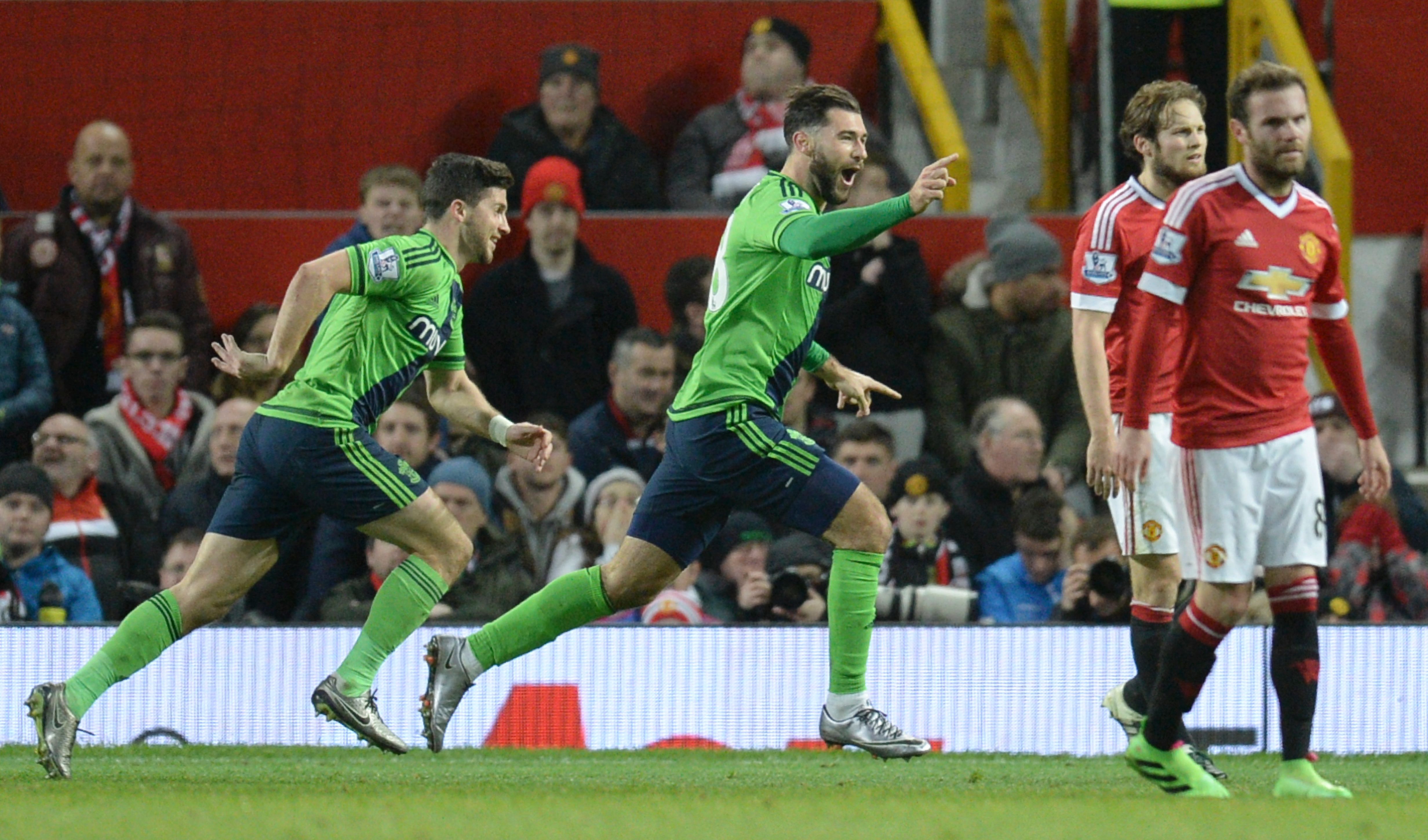 Southampton's English striker Charlie Austin (C) celebrates scoring the opening goal during the English Premier League football match between Manchester United and Southampton at Old Trafford in Manchester, north west England, on January 23, 2016. AFP PHOTO / OLI SCARFF

RESTRICTED TO EDITORIAL USE. No use with unauthorized audio, video, data, fixture lists, club/league logos or 'live' services. Online in-match use limited to 75 images, no video emulation. No use in betting, games or single club/league/player publications. / AFP / OLI SCARFF        (Photo credit should read OLI SCARFF/AFP/Getty Images)