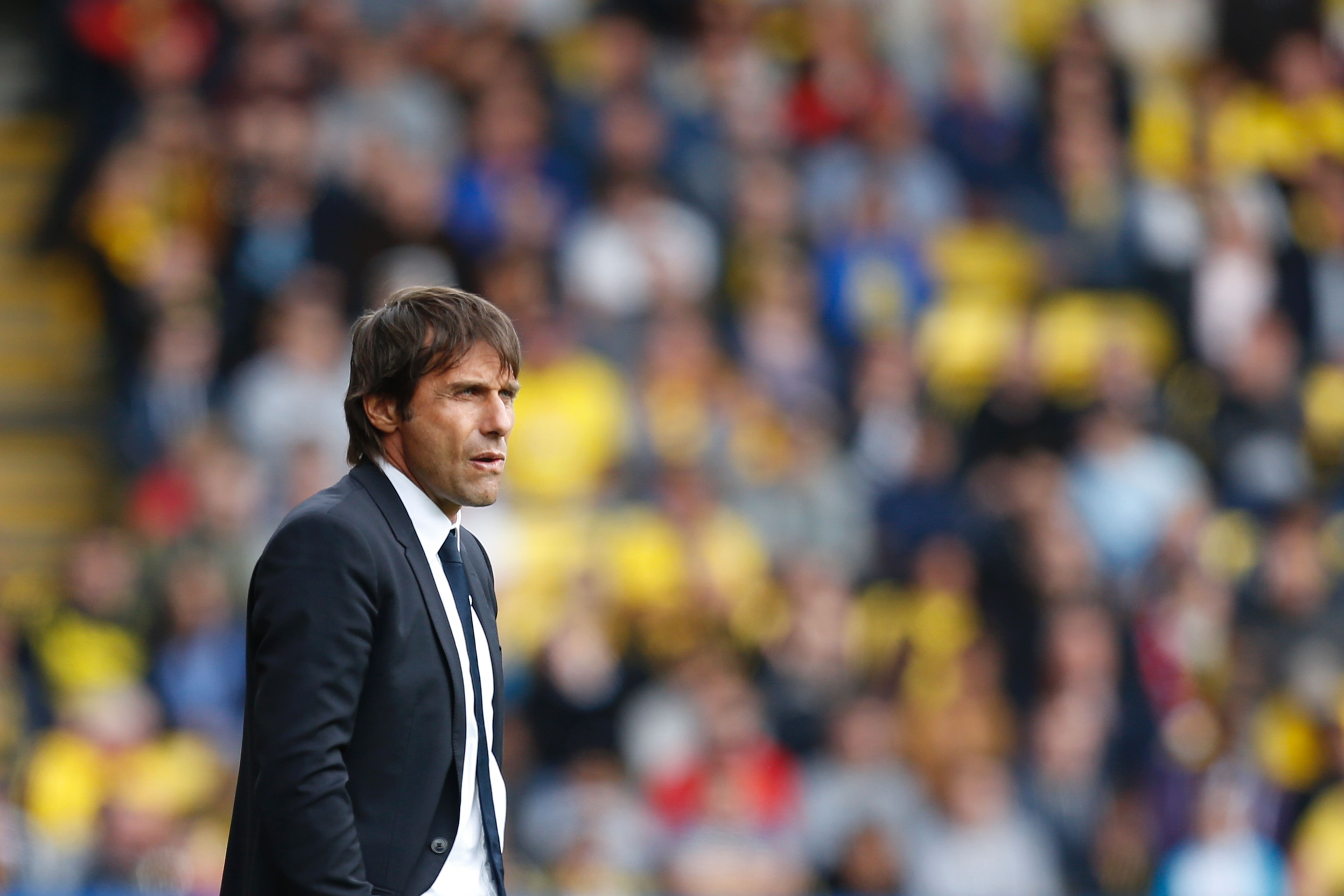 Chelsea's Italian head coach Antonio Conte watches from the touchline during the English Premier League football match between Watford and Chelsea at Vicarage Road Stadium in Watford, north of London on August 20, 2016. / AFP / Ian Kington / RESTRICTED TO EDITORIAL USE. No use with unauthorized audio, video, data, fixture lists, club/league logos or 'live' services. Online in-match use limited to 75 images, no video emulation. No use in betting, games or single club/league/player publications.  /         (Photo credit should read IAN KINGTON/AFP/Getty Images)