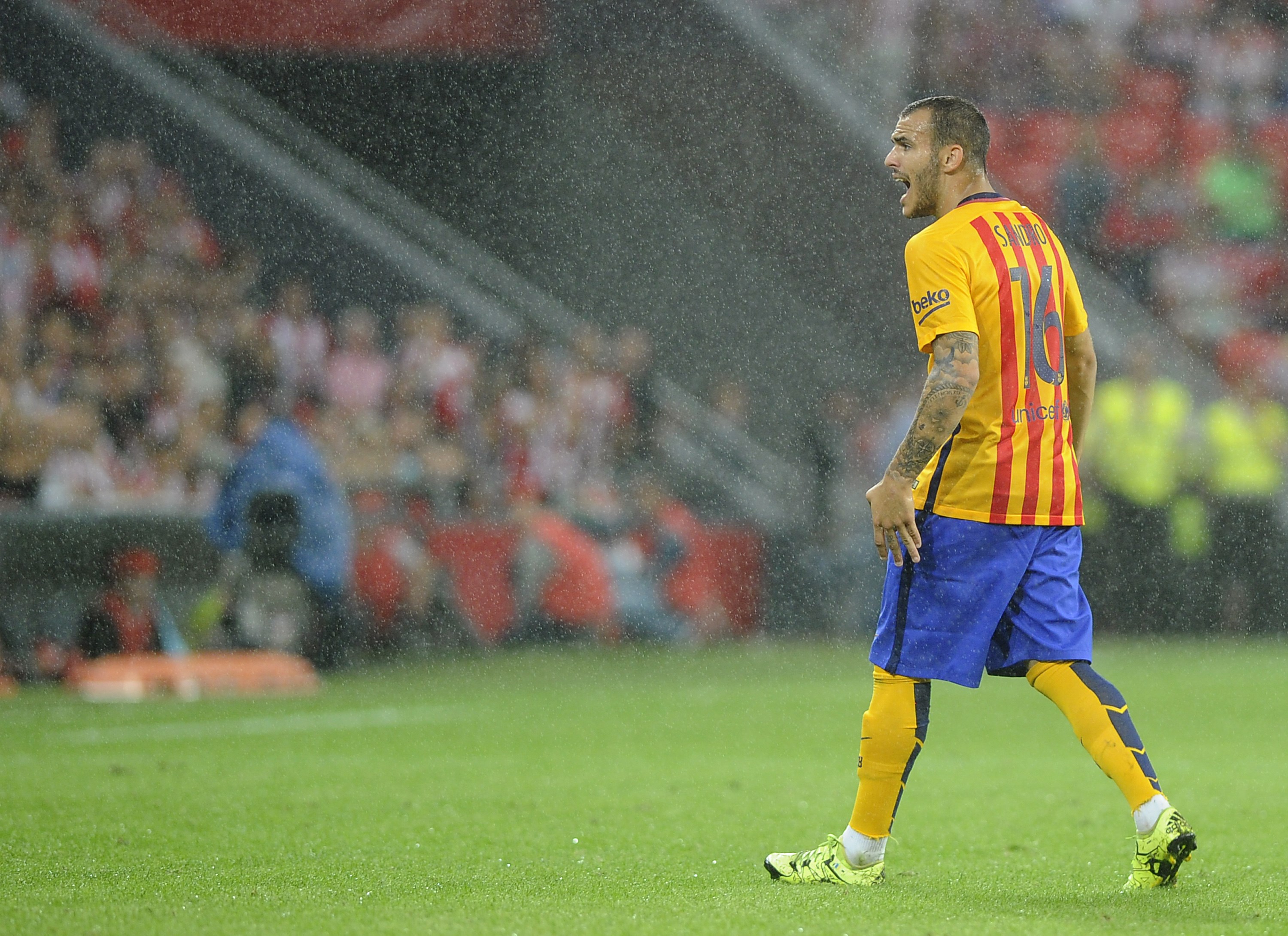 Barcelona's Brazilian defender Douglas shouts during the Spanish Supercup first-leg football match Athletic Club Bilbao vs FC Barcelona at the San Mames stadium in Bilbao on August 14, 2015. Athletic Bilbao won the match 4-0. AFP PHOTO/ ANDER GILLENEA        (Photo credit should read ANDER GILLENEA/AFP/Getty Images)