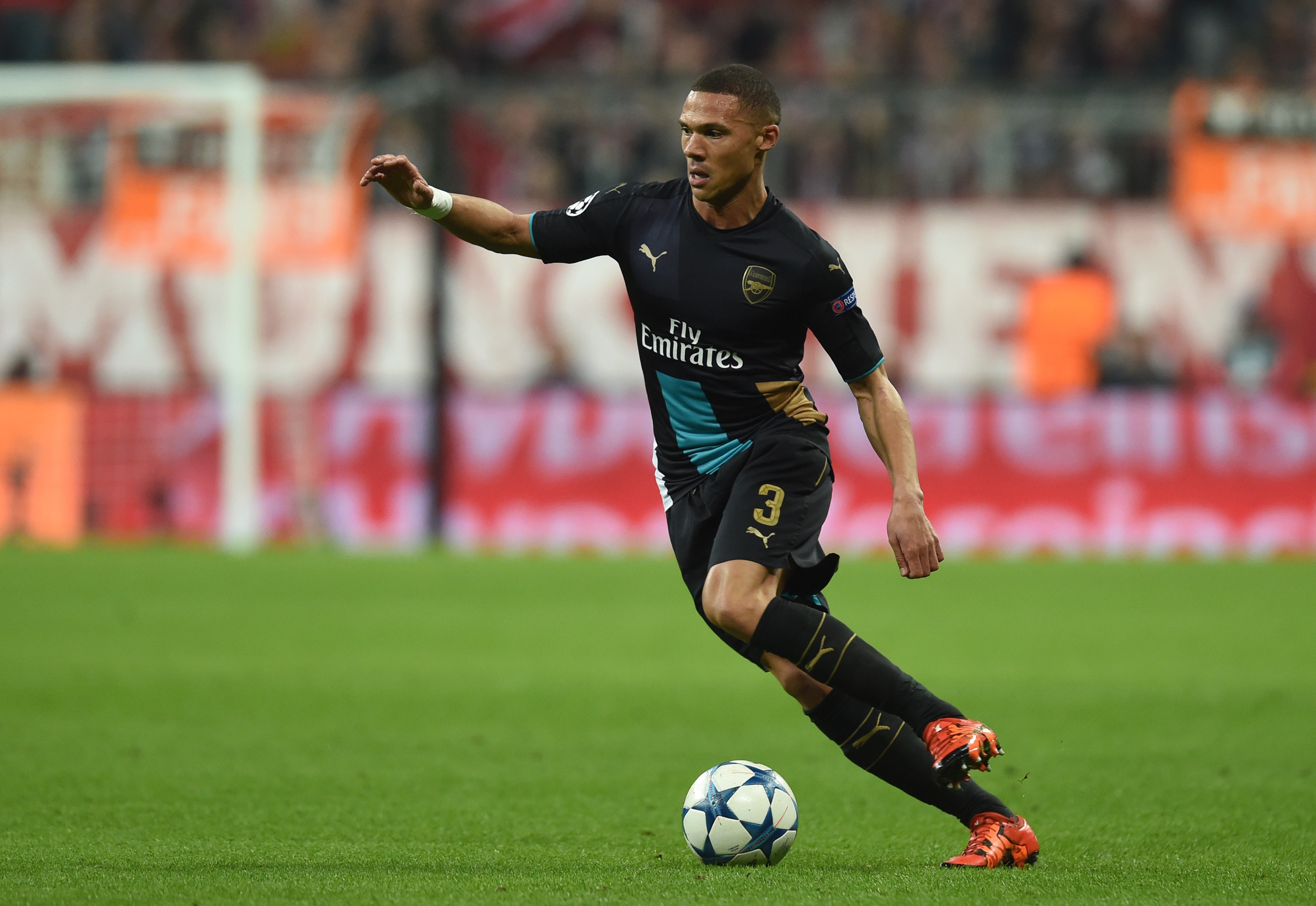 Arsenal's English defender Kieran Gibbs runs with the ball during the UEFA Champions League Group F second-leg football match between FC Bayern Munich and Arsenal FC in Munich, southern Germany, on November 4, 2015. Bayern won the match 5-1. AFP PHOTO / CHRISTOF STACHE        (Photo credit should read CHRISTOF STACHE/AFP/Getty Images)