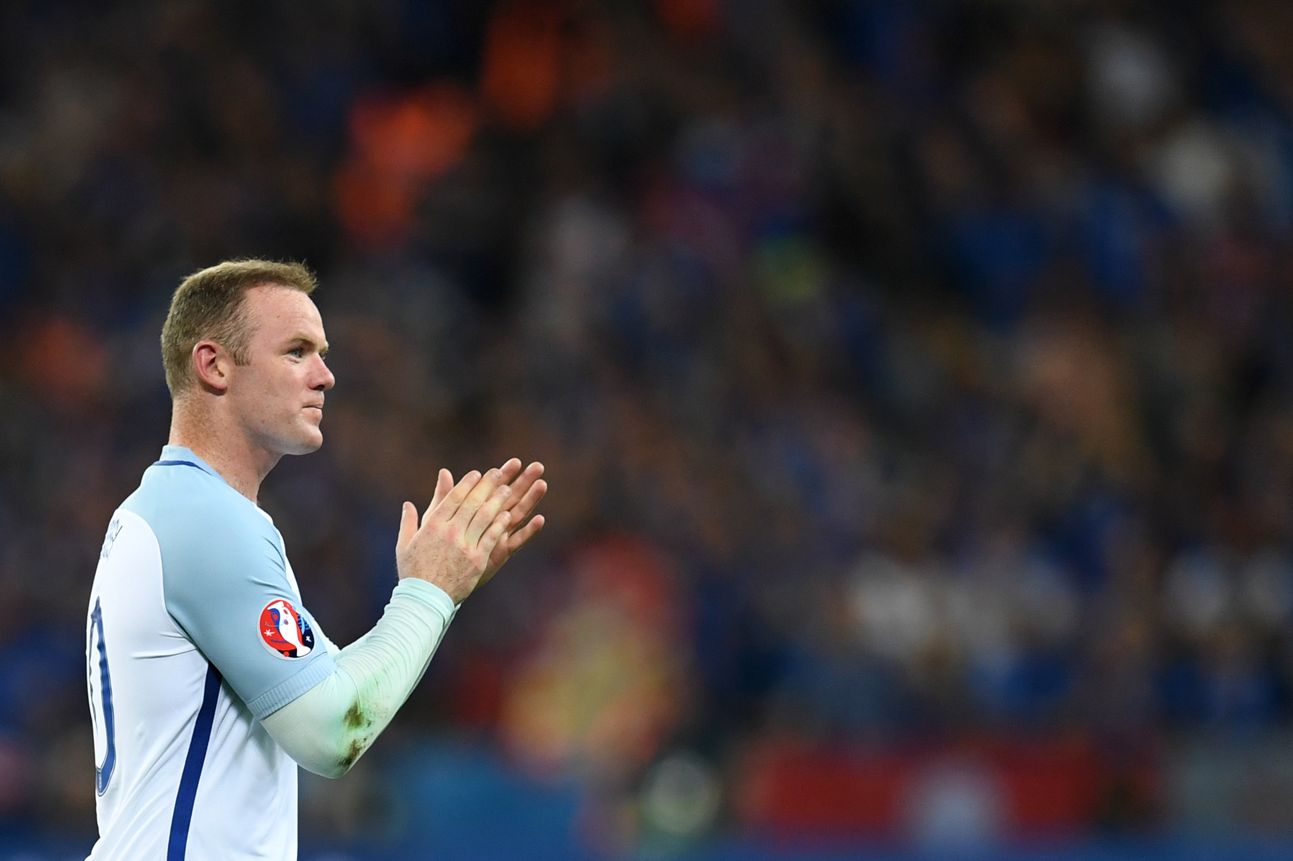 England's forward Wayne Rooney acknowledges the fans after England lost 2-1 to Iceland in the Euro 2016 round of 16 football match between England and Iceland at the Allianz Riviera stadium in Nice on June 27, 2016.   / AFP / PAUL ELLIS        (Photo credit should read PAUL ELLIS/AFP/Getty Images)