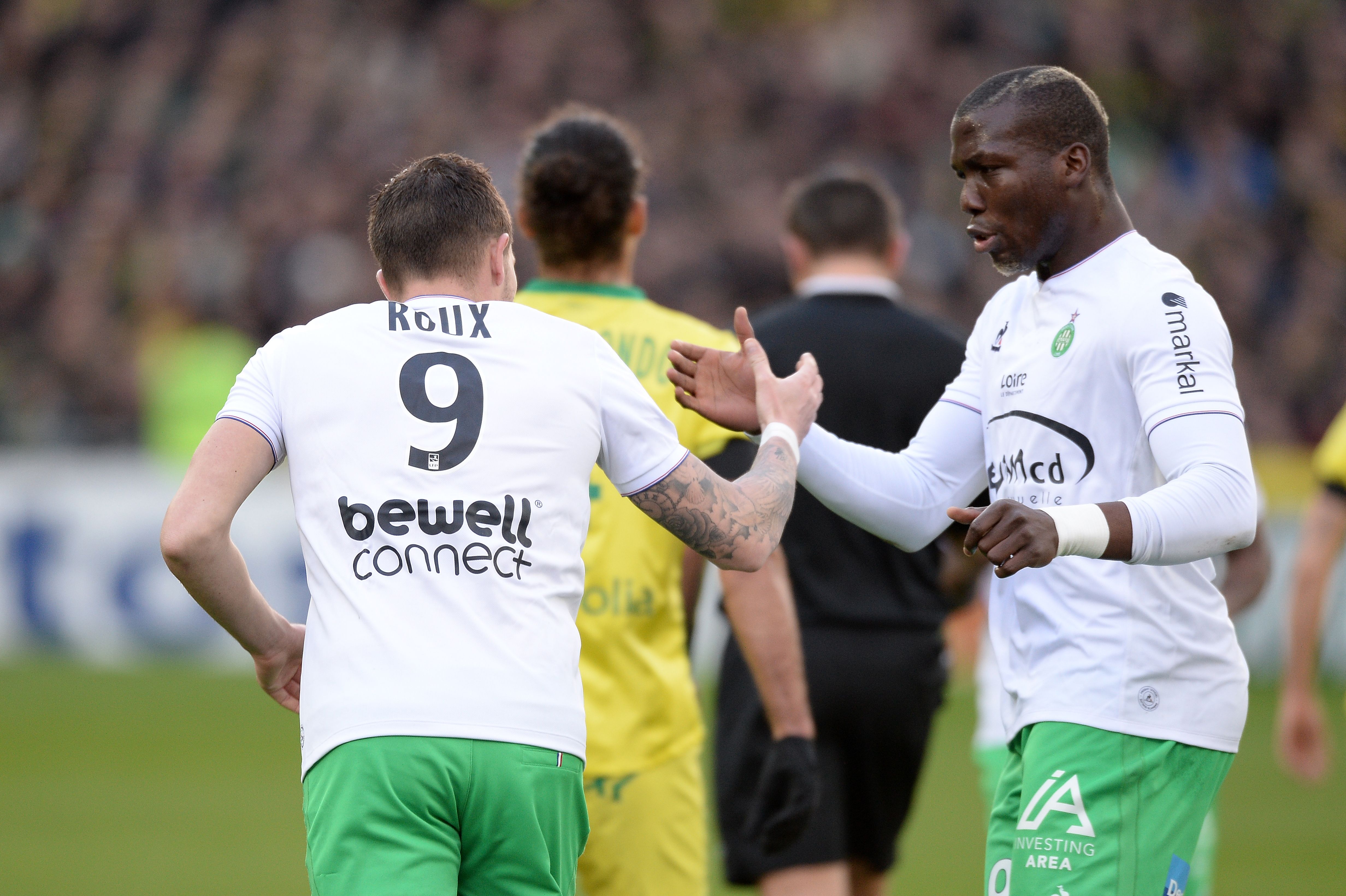 Saint-Etienne's French forward Nolan Roux (L) is congratulated by his teammate Saint-Etienne's Guinean defender Florentin Pogba after he scored a penalty during the French L1 football match between Nantes and Saint-Etienne on January 10, 2015 at the Beaujoire stadium in Nantes, western France. AFP PHOTO/ JEAN-SEBASTIEN EVRARD / AFP / JEAN-SEBASTIEN EVRARD        (Photo credit should read JEAN-SEBASTIEN EVRARD/AFP/Getty Images)