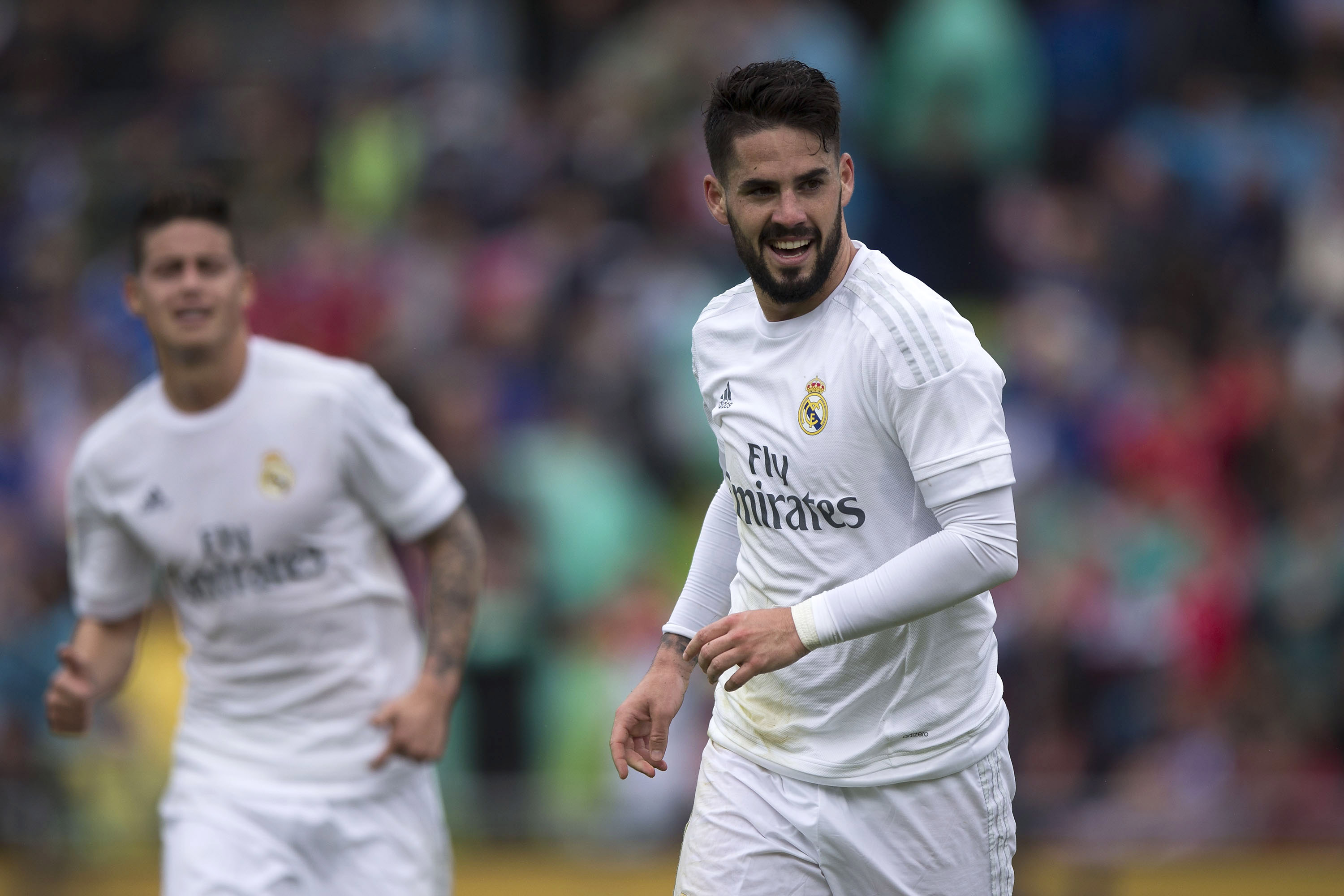 GETAFE, SPAIN - APRIL 16:  Francisco Roman Alarcon alias Isco (R) of Real Madrid CF celebrates scoring their second goal during the La Liga match between Getafe CF and Real Madrid CF at Coliseum Alfonso Perez on April 16, 2016 in Getafe, Spain.  (Photo by Gonzalo Arroyo Moreno/Getty Images)