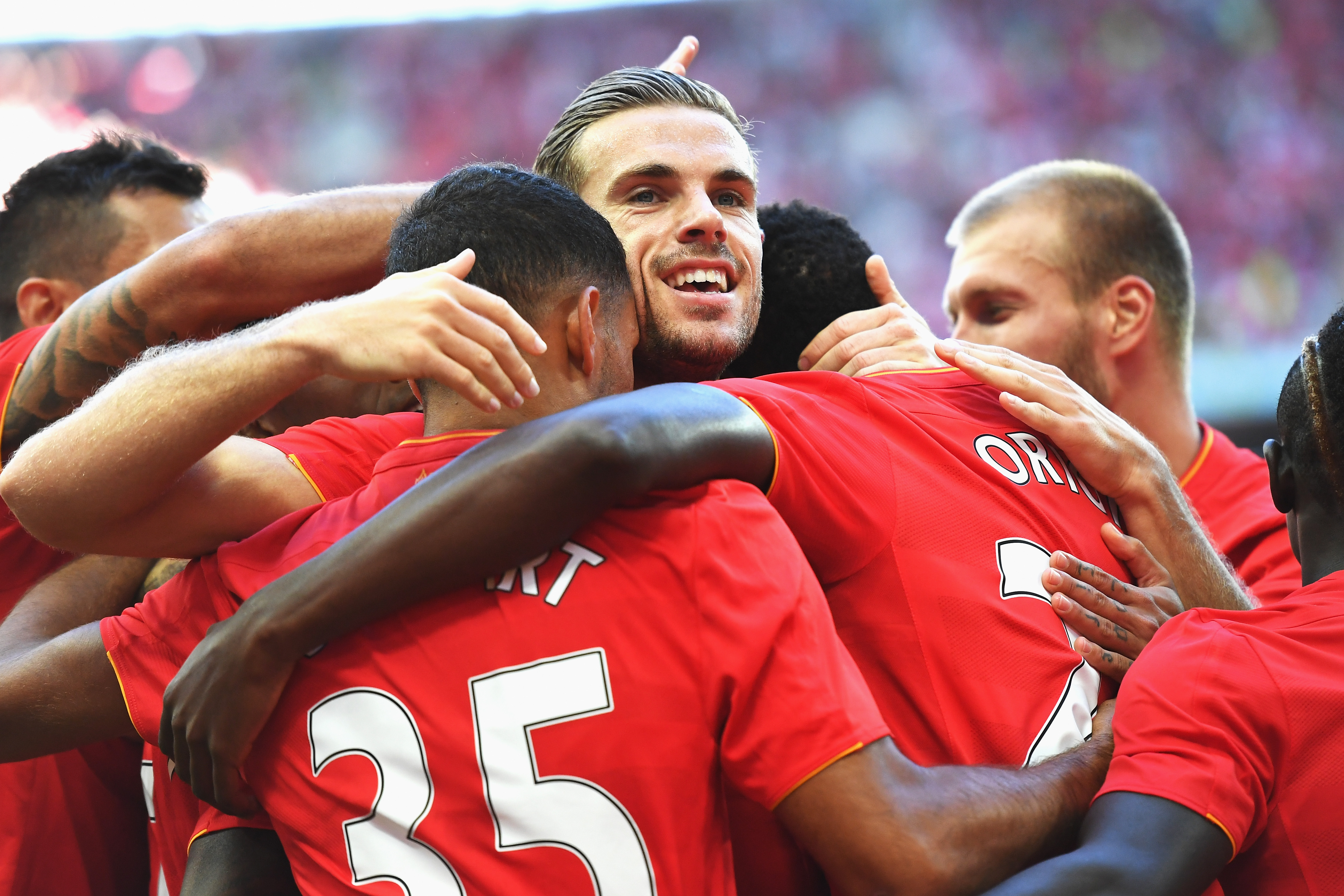 LONDON, ENGLAND - AUGUST 06:  Liverpool players including Jordan Henderson celebrate the third goal scored by Divock Origi of Liverpool during the International Champions Cup match between Liverpool and Barcelona at Wembley Stadium on August 6, 2016 in London, England.  (Photo by Mike Hewitt/Getty Images)
