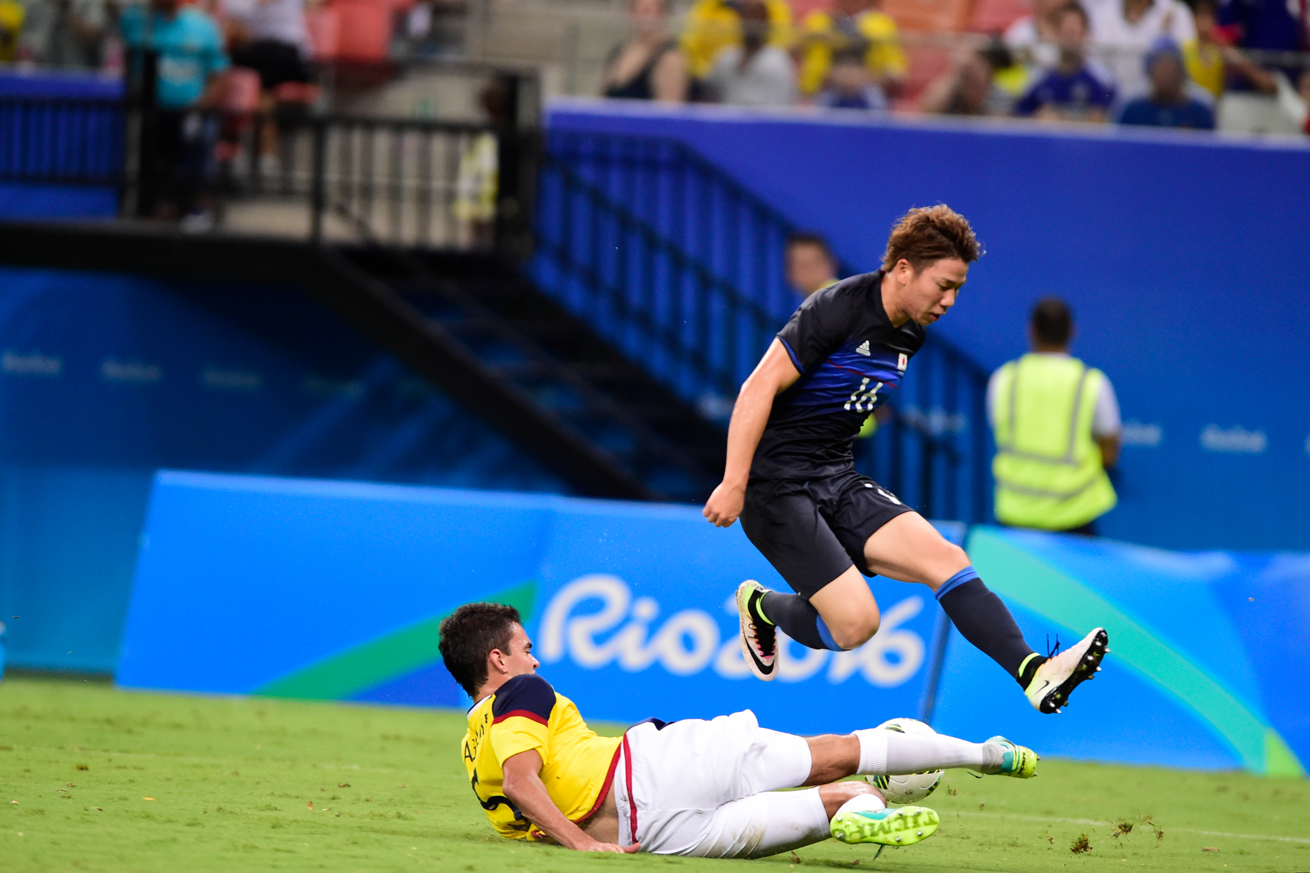 MANAUS, BRAZIL - AUGUST 07:  Takuma Asano player of Japan battles for the ball with Felipe Aguilar player of Colombia during 2016 Summer Olympics match between Japan and Colombi at Arena Amazonia on August 7, 2016 in Manaus, Brazil. (Photo by Bruno Zanardo/Getty Images)