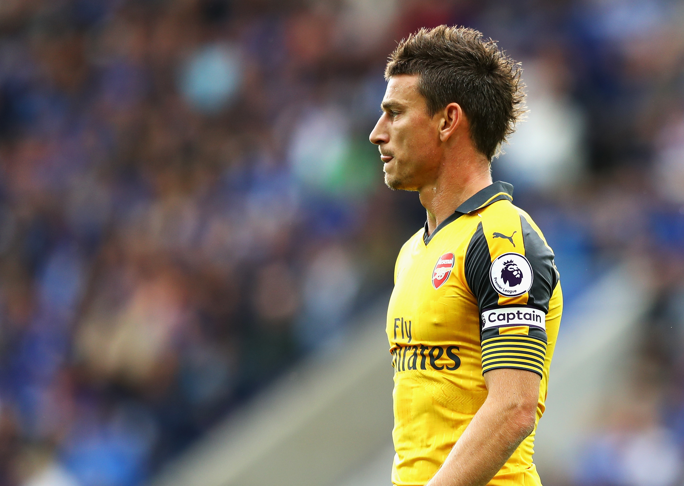 LEICESTER, ENGLAND - AUGUST 20: Laurent Koscielny of Arsenal looks on during the Premier League match between Leicester City and Arsenal at The King Power Stadium on August 20, 2016 in Leicester, England.  (Photo by Michael Steele/Getty Images)