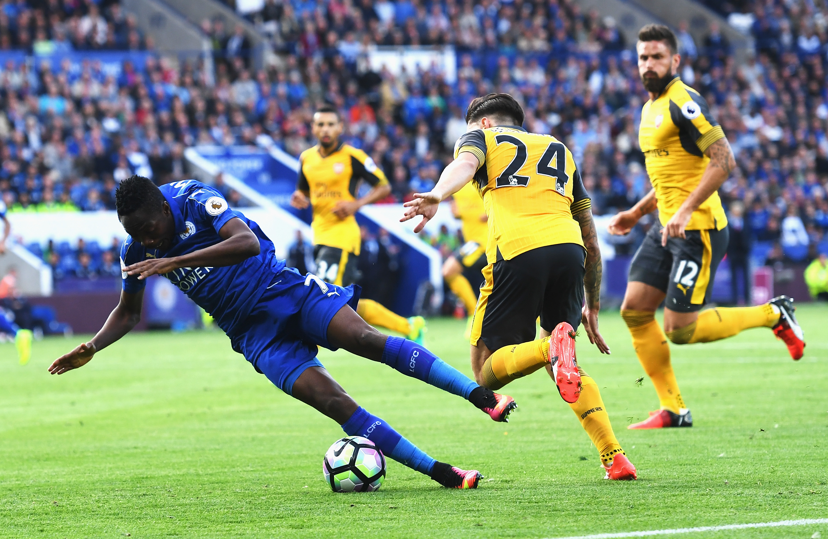 LEICESTER, ENGLAND - AUGUST 20: Ahmed Musa of Leicester City is taken down by Hector Bellerin of Arsenal during the Premier League match between Leicester City and Arsenal at The King Power Stadium on August 20, 2016 in Leicester, England.  (Photo by Michael Regan/Getty Images)