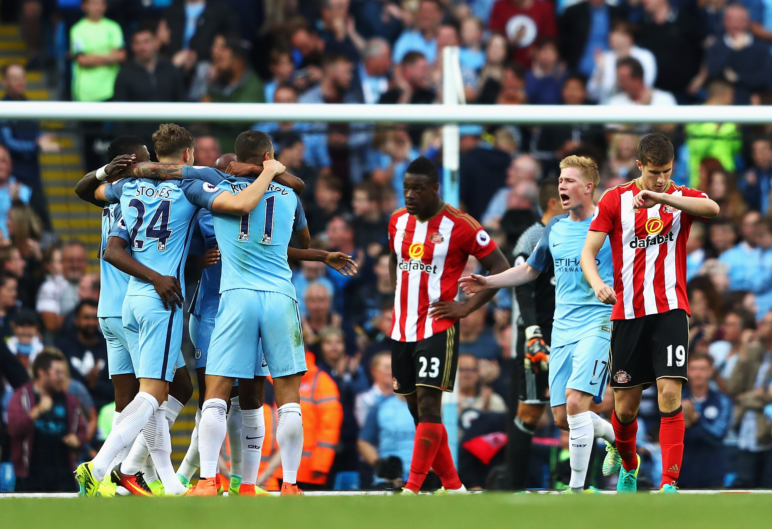 MANCHESTER, ENGLAND - AUGUST 13: Manchester City players celebrate after Paddy McNair of Sunderland scored a own goal to score Manchester City's second goal during the Premier League match between Manchester City and Sunderland at Etihad Stadium on August 13, 2016 in Manchester, England.  (Photo by Michael Steele/Getty Images)