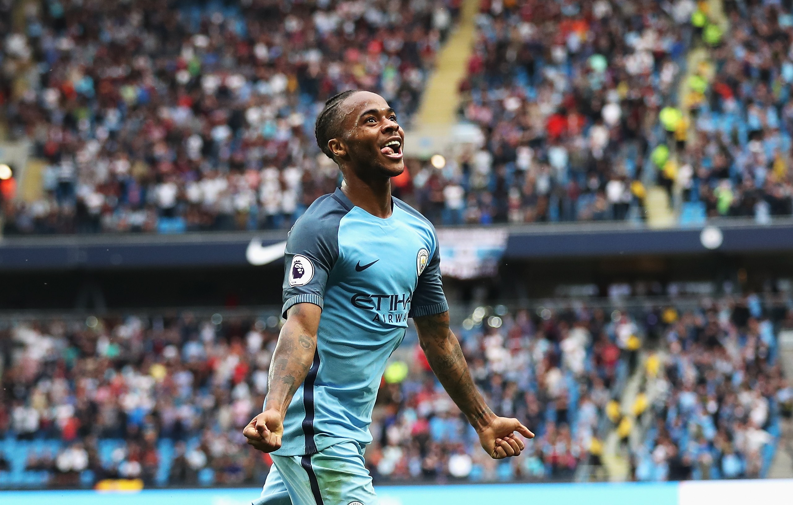 MANCHESTER, ENGLAND - AUGUST 28:  Raheem Sterling of Manchester City celebrates scoring his second goal and his team's third with Fernandinho of Manchester City during the Premier League match between Manchester City and West Ham United at Etihad Stadium on August 28, 2016 in Manchester, England.  (Photo by Chris Brunskill/Getty Images)