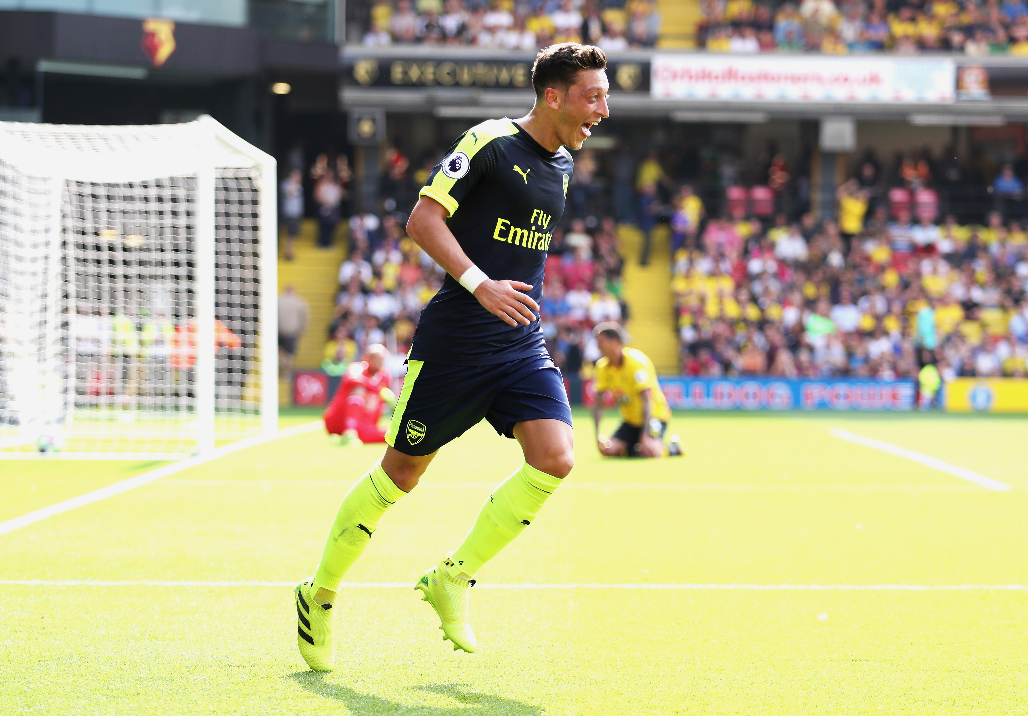 WATFORD, ENGLAND - AUGUST 27: Mesut Ozil of Arsenal celebrates scoring his sides third goal during the Premier League match between Watford and Arsenal at Vicarage Road on August 27, 2016 in Watford, England.  (Photo by Christopher Lee/Getty Images)