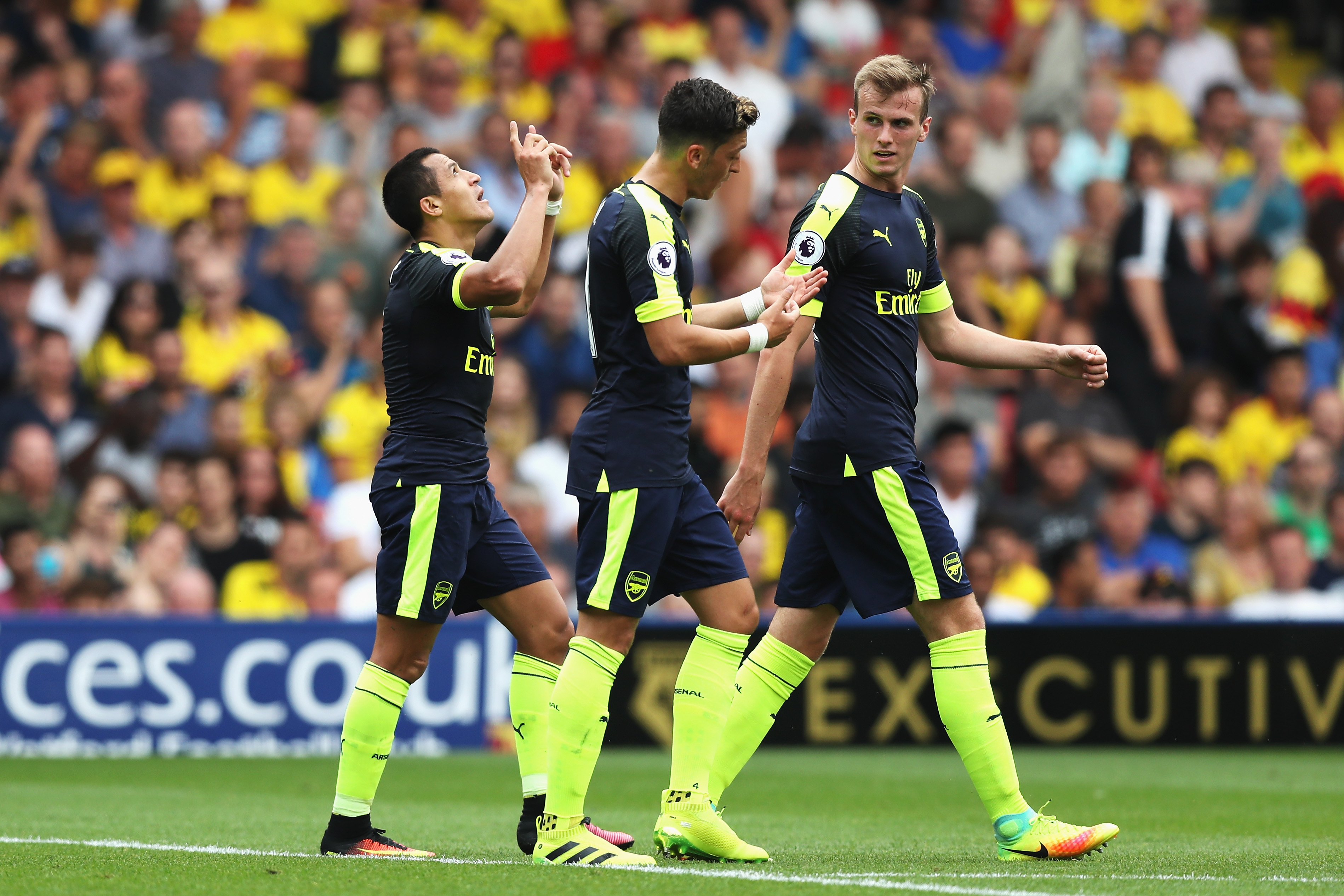 WATFORD, ENGLAND - AUGUST 27: Alexis Sanchez of Arsenal (L) celebrates scoring his sides second goal during the Premier League match between Watford and Arsenal at Vicarage Road on August 27, 2016 in Watford, England.  (Photo by Christopher Lee/Getty Images)