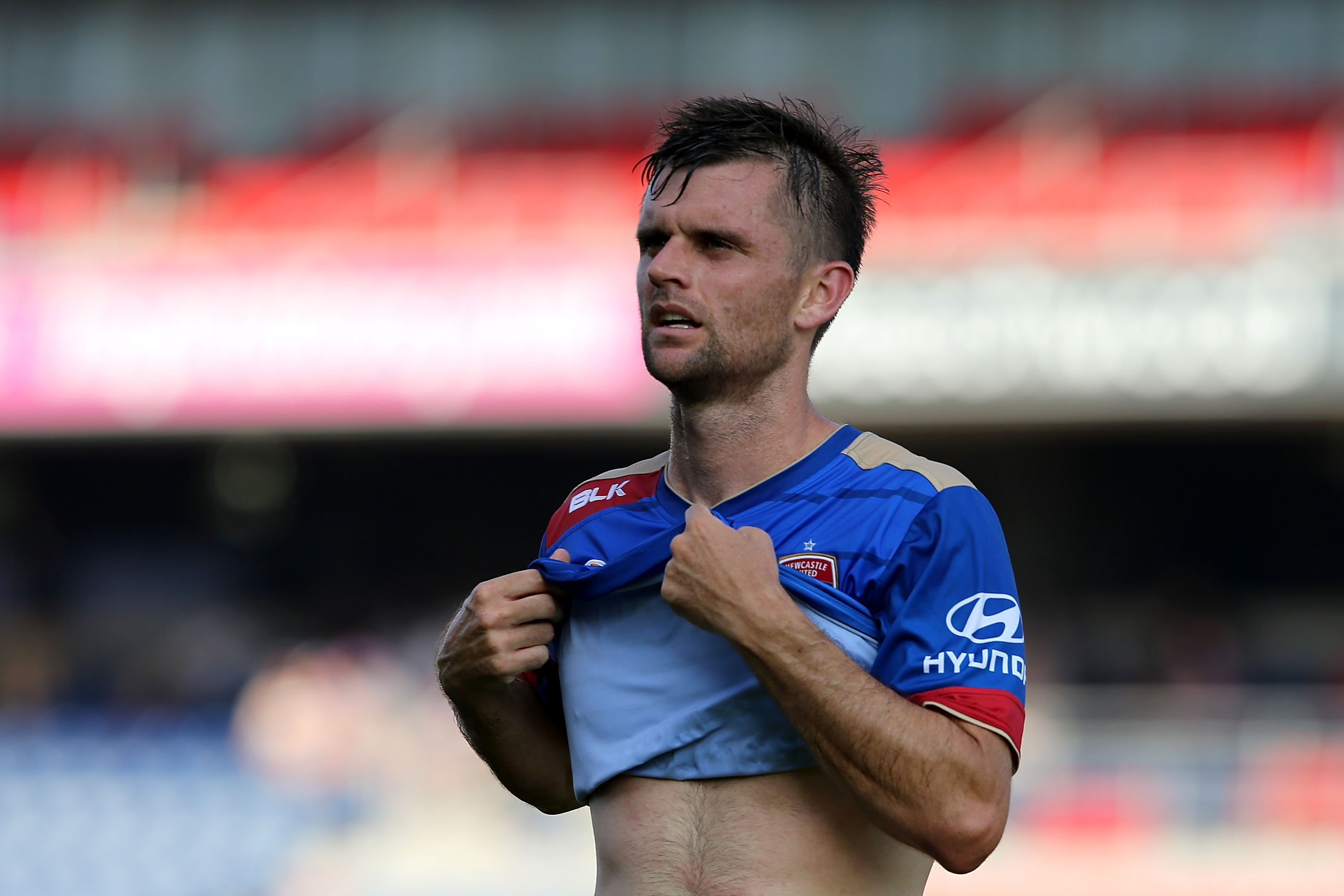 NEWCASTLE, AUSTRALIA - JANUARY 24: Cameron Watson of the Jets cools off during the round 16 A-League match between the Newcastle Jets and the Perth Glory at Hunter Stadium on January 24, 2016 in Newcastle, Australia.  (Photo by Ashley Feder/Getty Images)