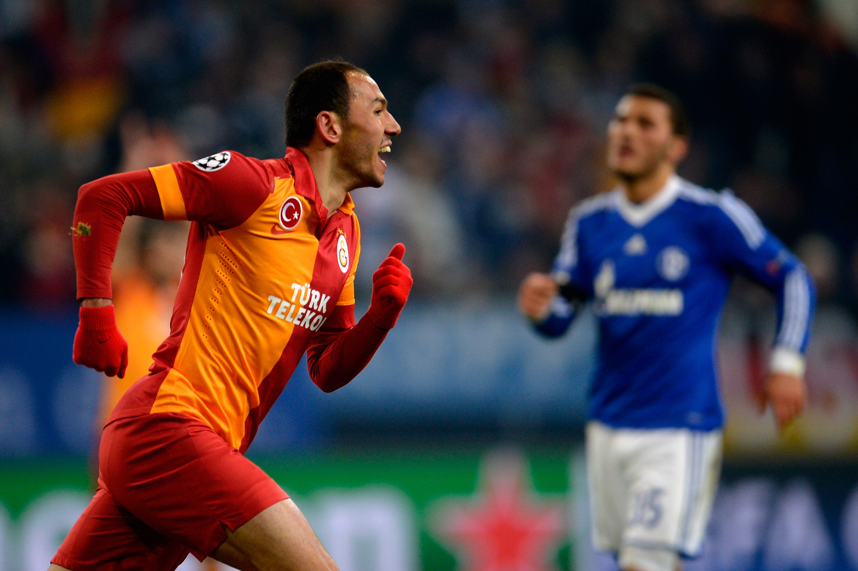 GELSENKIRCHEN, GERMANY - MARCH 12:  Umut Bulut of Galatasaray celebrates after scoring his team's third goal during the UEFA Champions League round of 16 second leg match between Schalke 04 and Galatasaray AS at Veltins-Arena on March 12, 2013 in Gelsenkirchen, Germany.  (Photo by Dennis Grombkowski/Getty Images)