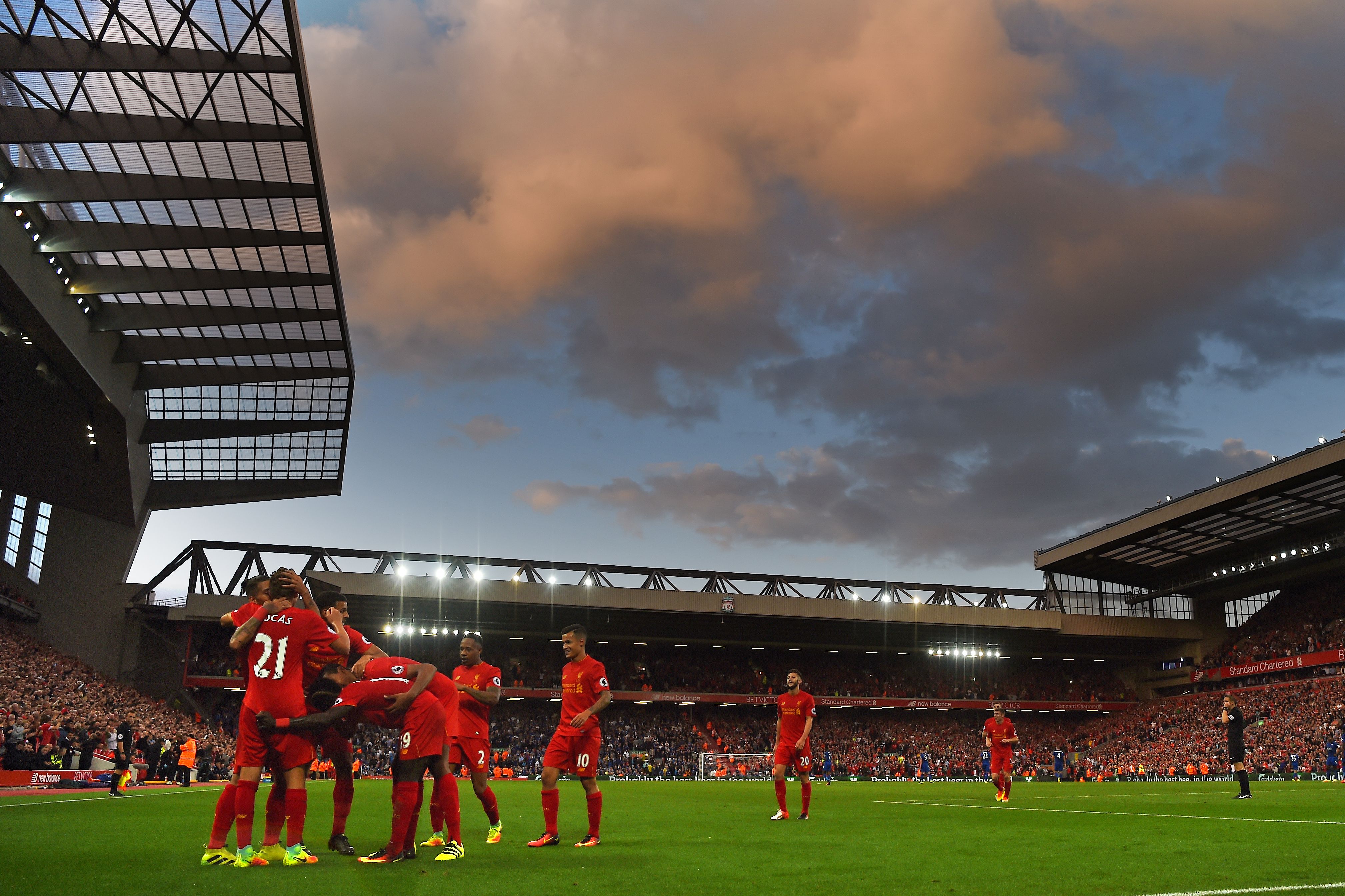 Liverpool's players celebrate together after Firminho scores their fourth goal during the English Premier League football match between Liverpool and Leicester City at Anfield in Liverpool, north west England on September 10, 2016.
Liverpool won the game 4-1. / AFP / Paul ELLIS / RESTRICTED TO EDITORIAL USE. No use with unauthorized audio, video, data, fixture lists, club/league logos or 'live' services. Online in-match use limited to 75 images, no video emulation. No use in betting, games or single club/league/player publications.  /         (Photo credit should read PAUL ELLIS/AFP/Getty Images)