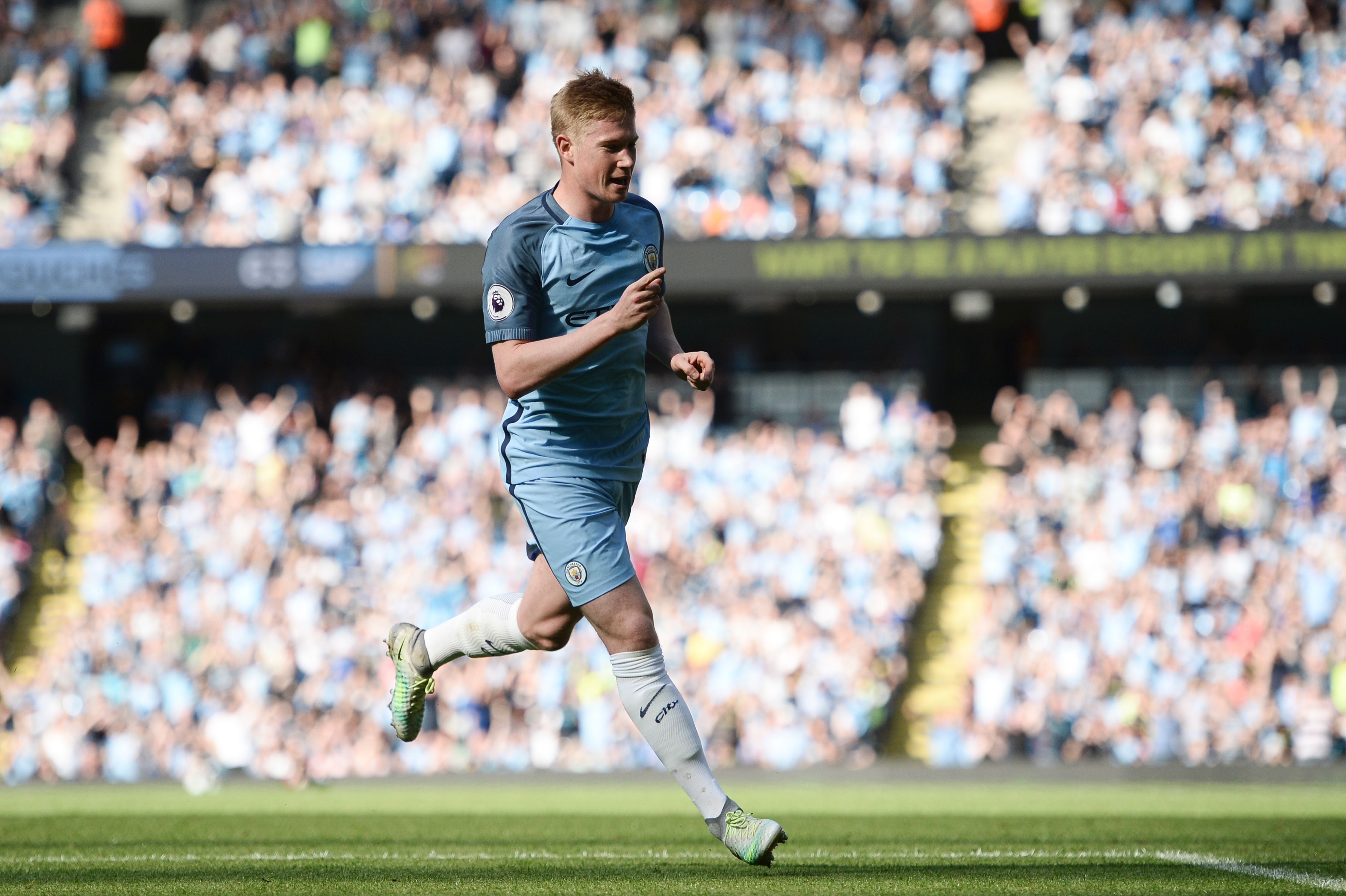 Manchester City's Belgian midfielder Kevin De Bruyne celebrates scoring the opening goal during the English Premier League football match between Manchester City and Bournemouth at the Etihad Stadium in Manchester, north west England, on September 17, 2016. / AFP / OLI SCARFF / RESTRICTED TO EDITORIAL USE. No use with unauthorized audio, video, data, fixture lists, club/league logos or 'live' services. Online in-match use limited to 75 images, no video emulation. No use in betting, games or single club/league/player publications.  /         (Photo credit should read OLI SCARFF/AFP/Getty Images)