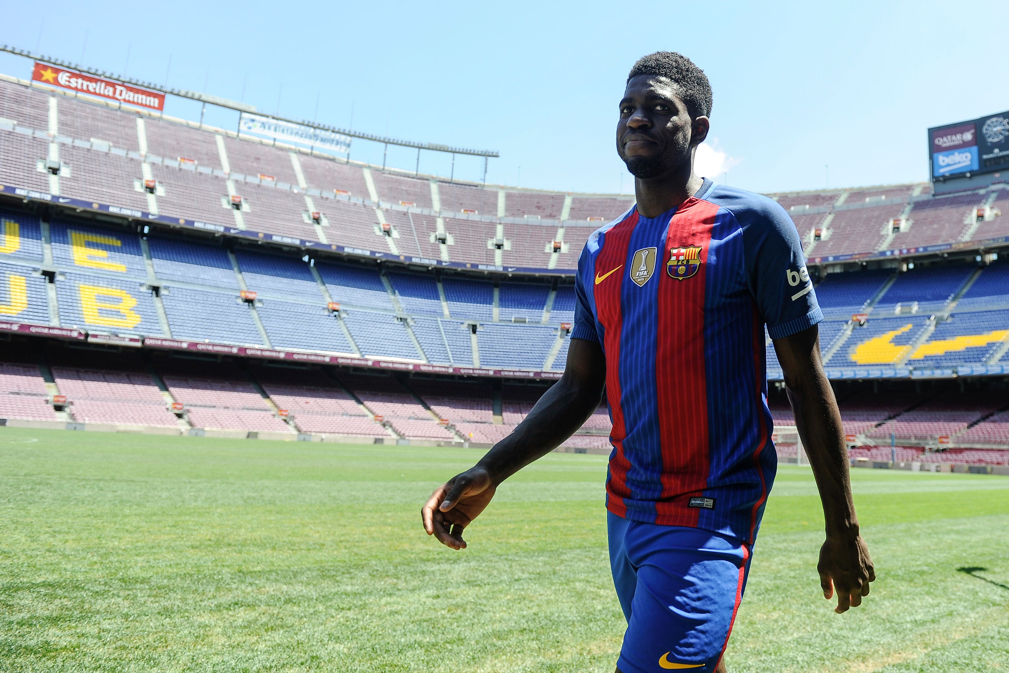 New Barcelona's French defender Samuel Umtiti smiles during his official presentation at the Camp Nou stadium in Barcelona on July 15, 2016, after signing his new contract with the Catalan club. / AFP / JOSEP LAGO        (Photo credit should read JOSEP LAGO/AFP/Getty Images)