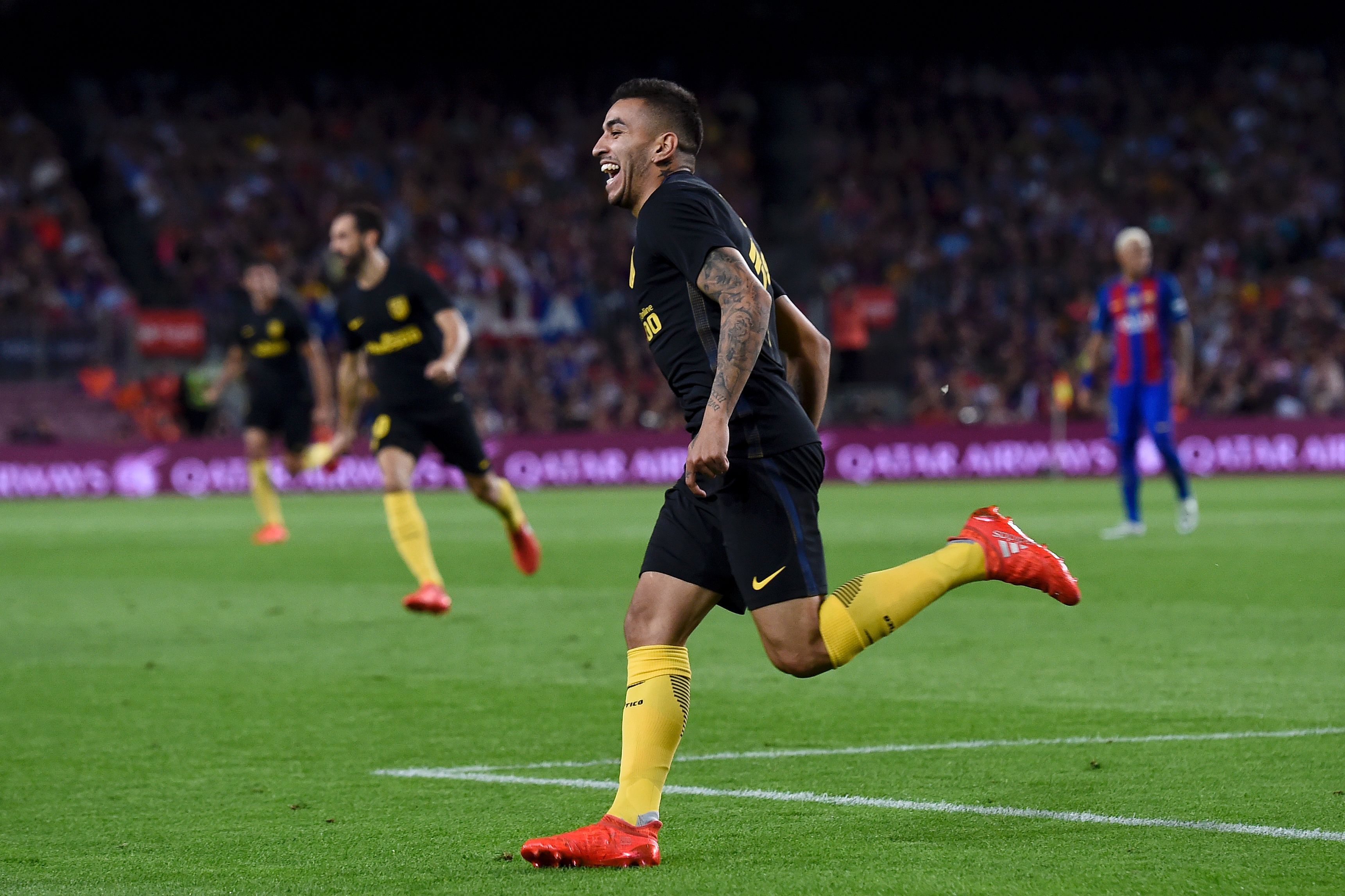 Atletico Madrid's Argentinian forward Angel Correa celebrates his goal during the Spanish league football match FC Barcelona vs Atletico de Madrid at the Camp Nou stadium in Barcelona on September 21, 2016. / AFP / JOSEP LAGO        (Photo credit should read JOSEP LAGO/AFP/Getty Images)