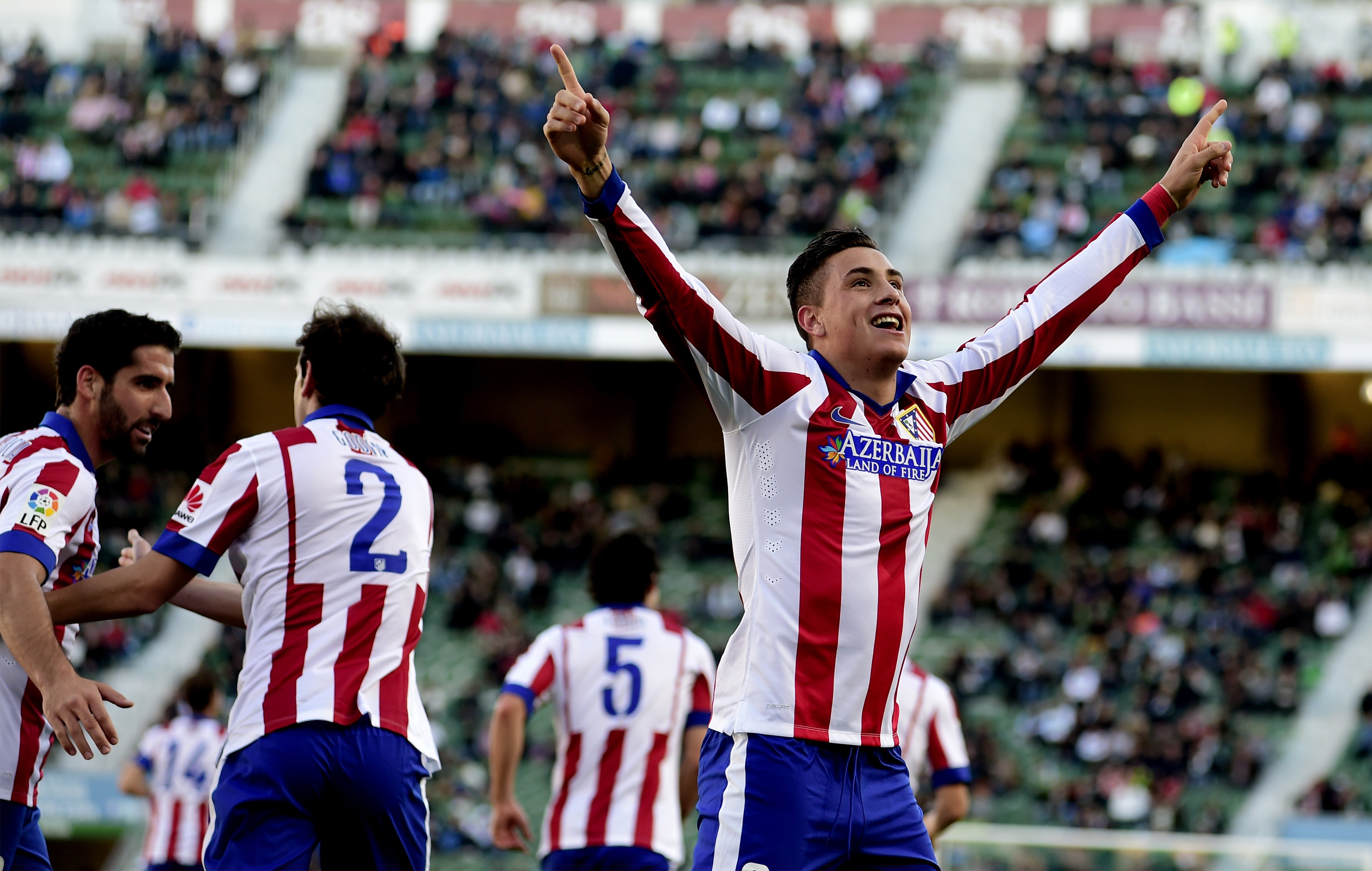 Atletico Madrid's Uruguayan defender Jose Maria Gimenez celebrates after scoring during the Spanish league football match Elche FC vs Club Atletico Madrid at the Martin Valero stadium in Valencia on December 6, 2014.     (Photo credit should read JOSE JORDAN/AFP/Getty Images)