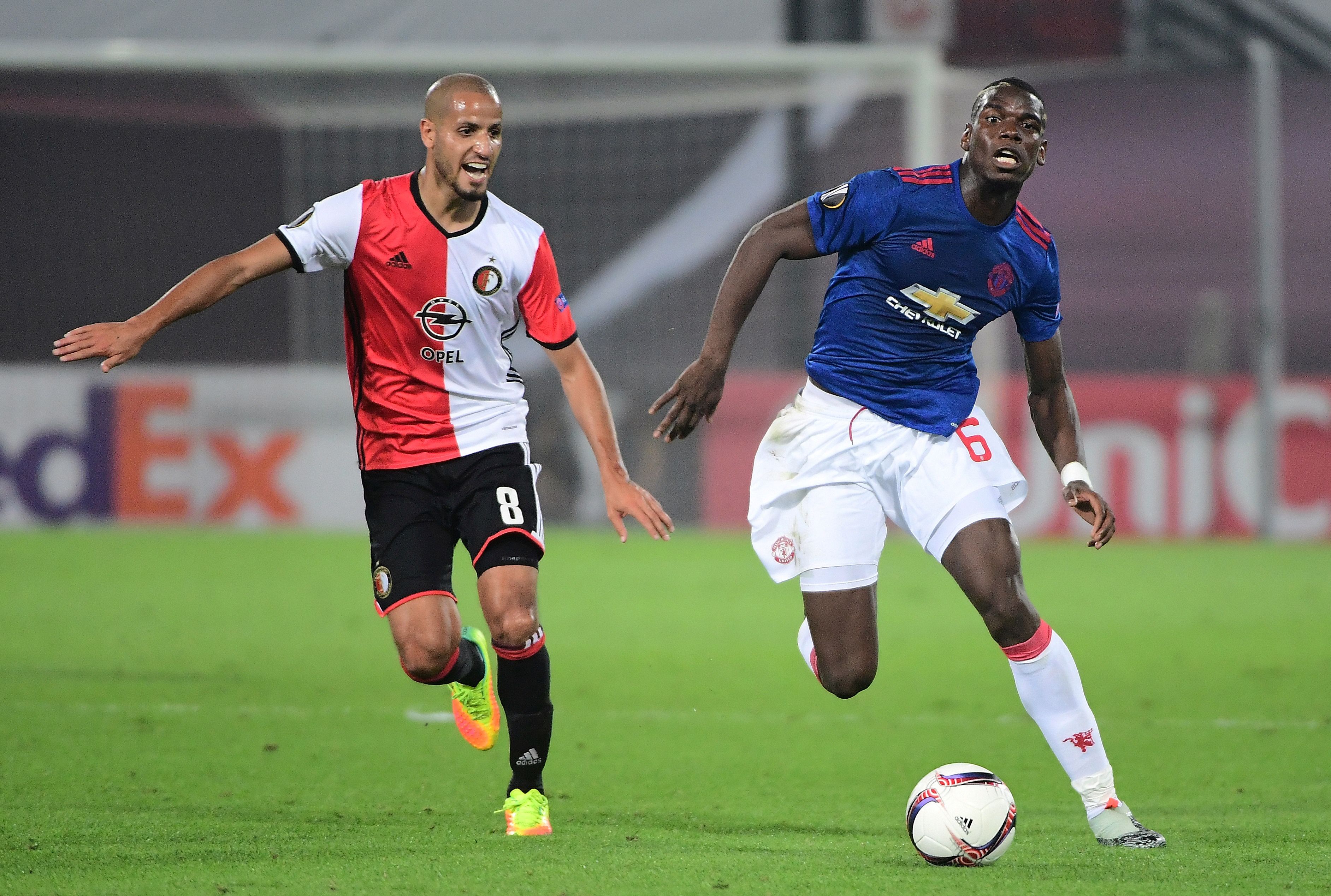 Manchester United's Paul Pogba (R) vies with Feyenoord's Karim El Ahmadi during the UEFA Europa League football match between Feyenoord Rotterdam and Manchester United at the Feyenoord Stadium in Rotterdam on September 15, 2016.
Feyenoord won the match 1-0. / AFP / EMMANUEL DUNAND        (Photo credit should read EMMANUEL DUNAND/AFP/Getty Images)