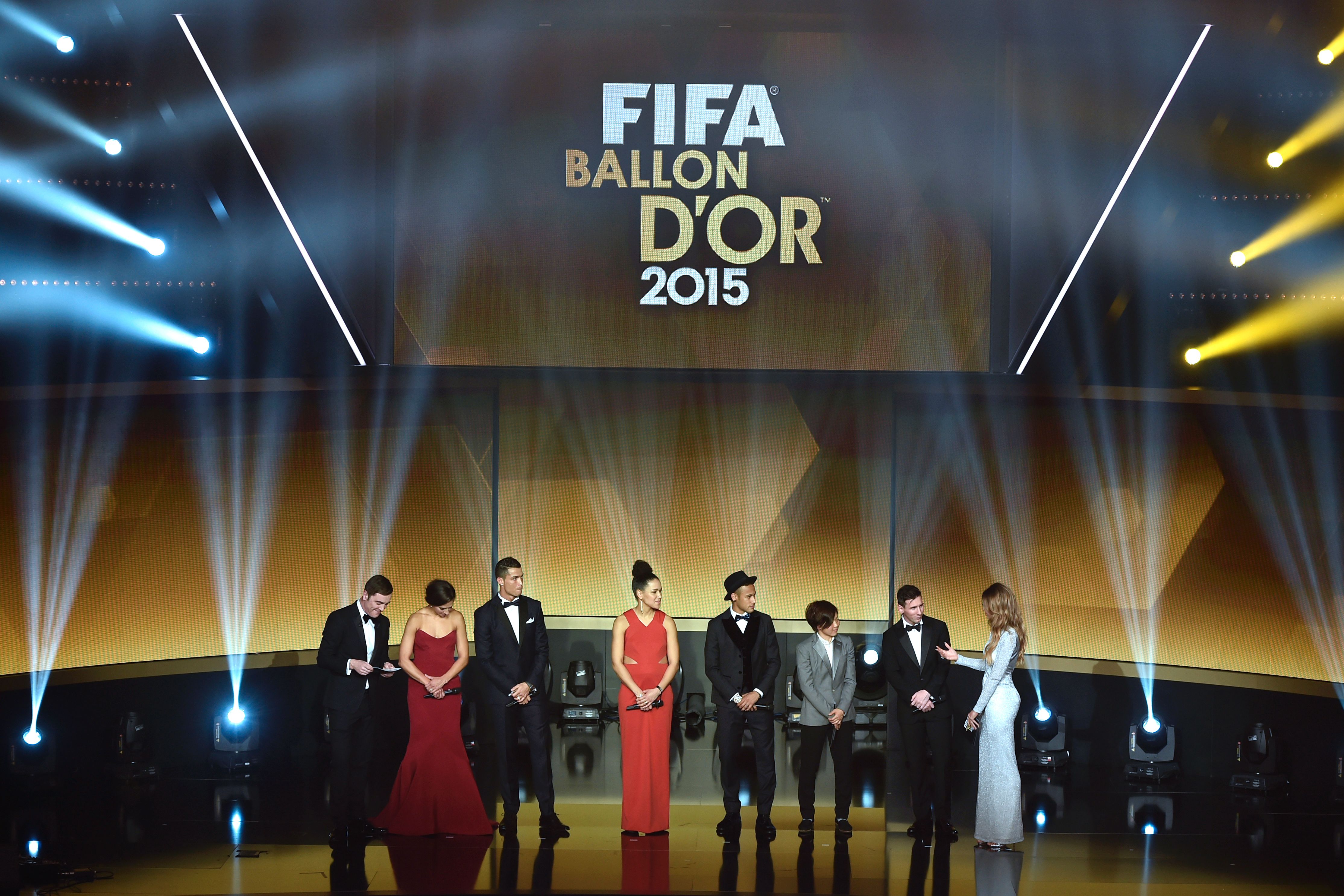 (From L) Northern Irish actor and host James Nesbitt, USA and Houston Dashs midfielder Carli Lloyd, Real Madrid and Portugal's forward Cristiano Ronaldo, Germany and 1 FFC Frankfurt's forward Celia Sasic, FC Barcelona and Brazils forward Neymar, Japan and Okayama Yunogo's Belle midfielder Aya Miyama, FC Barcelona and Argentina's forward Lionel Messi and British presenter and host Kate Abdo pose during the 2015 FIFA Ballon d'Or award ceremony at the Kongresshaus in Zurich on January 11, 2016.  AFP PHOTO / FABRICE COFFRINI / AFP / FABRICE COFFRINI        (Photo credit should read FABRICE COFFRINI/AFP/Getty Images)