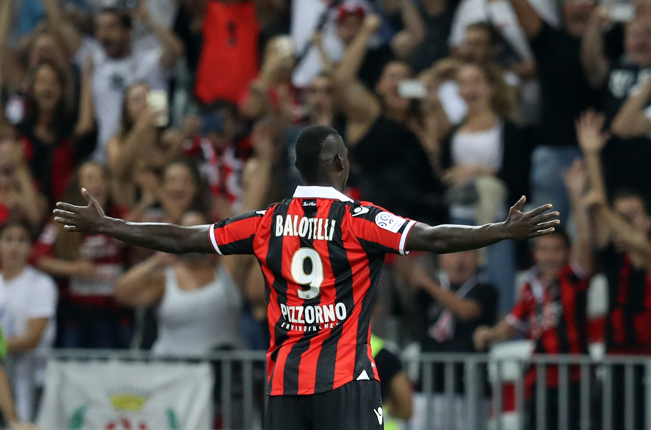 Nice's Italian forward Mario Balotelli celebrates after scoring a goal during the French L1 football match OGC Nice (OGCN) vs Olympique de Marseille (OM) on September 11, 2016 at the "Allianz Riviera" stadium in Nice, southeastern France.       (Photo by Valery Hache/AFP/Getty Images)