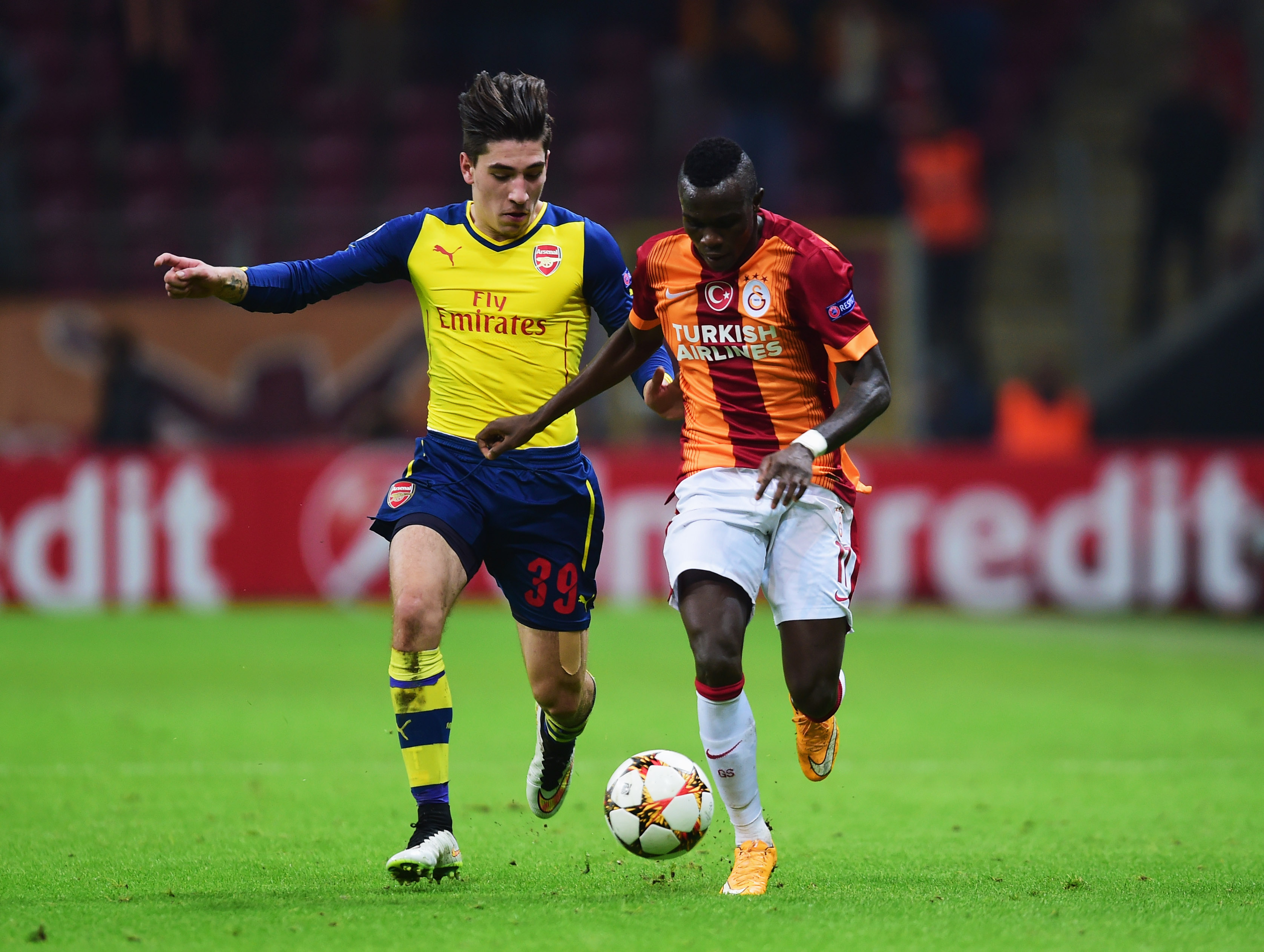 ISTANBUL, TURKEY - DECEMBER 09:  Hector Bellerin of Arsenal chases the ball with Bruma of Galatasaray during the UEFA Champions League Group D match between Galatasaray AS and Arsenal FC at Ali Sami Yen Arena on December 9, 2014 in Istanbul, Turkey.  (Photo by Jamie McDonald/Getty Images)