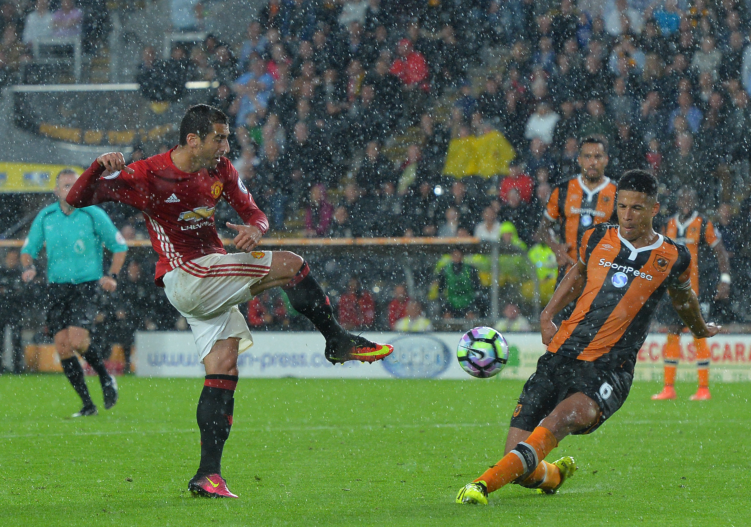 HULL, ENGLAND - AUGUST 27: Henrikh Mkhitaryan of Manchester United has his shot blocked by Curtis Davis of Hull City during the Premier League match between Manchester United FC and Hull City FC at KC Stadium on August 27, 2016 in Hull, England. (Photo by Mark Runnacles/Getty Images)