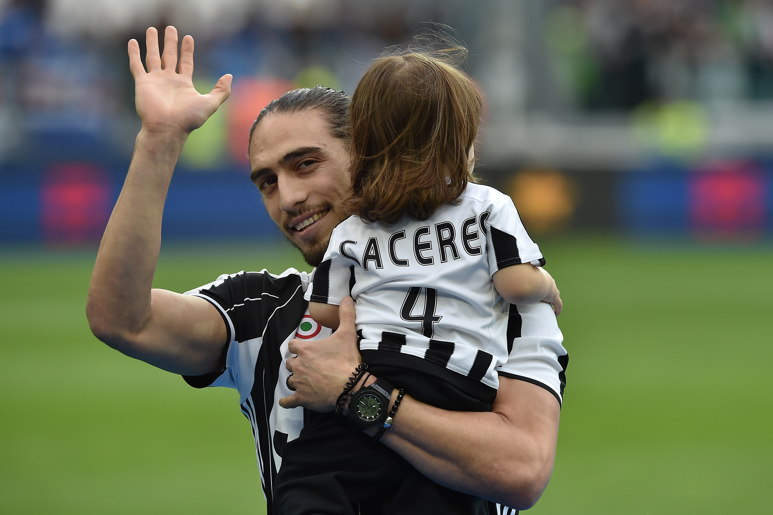TURIN, ITALY - MAY 14:  Martin Caceres of Juventus FC with his children celebrates after beating UC Sampdoria 5-0 to win the Serie A Championships after the Serie A match between Juventus FC and UC Sampdoria at Juventus Arena on May 14, 2016 in Turin, Italy.  (Photo by Valerio Pennicino/Getty Images)