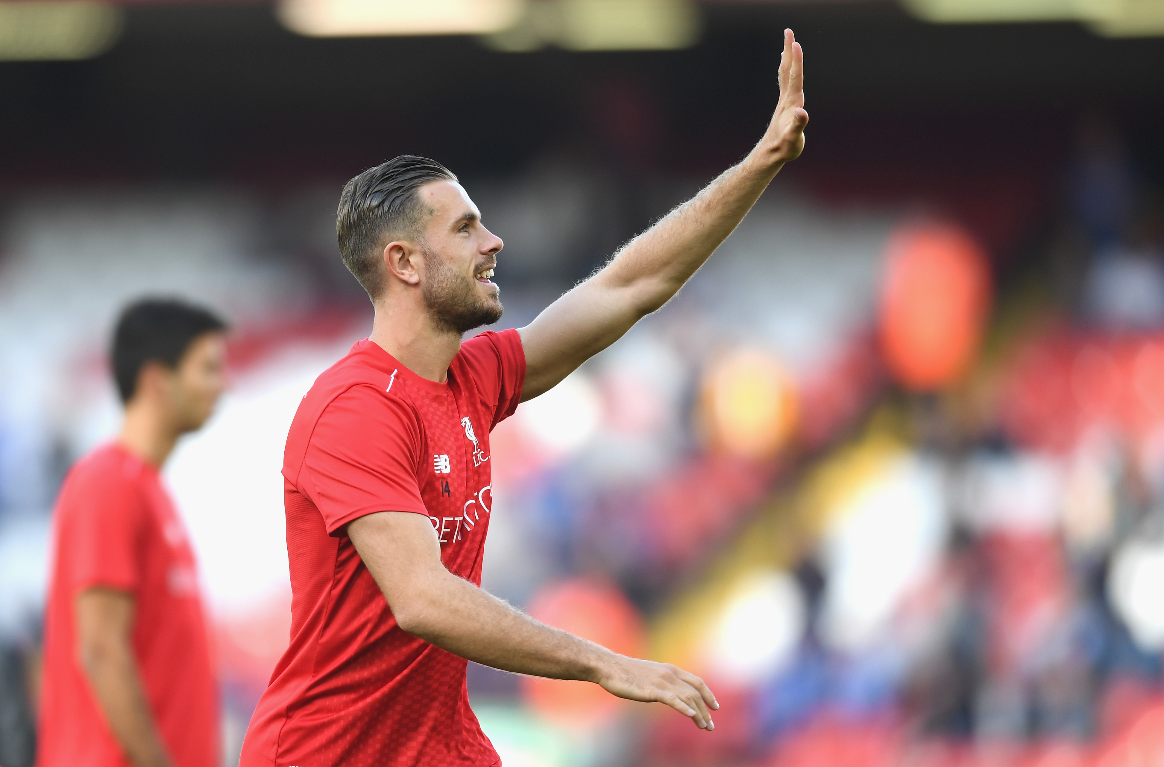 LIVERPOOL, ENGLAND - SEPTEMBER 10:  Jordan Henderson of Liverpool waves to fans during the warm up during the Premier League match between Liverpool and Leicester City at Anfield on September 10, 2016 in Liverpool, England.  (Photo by Michael Regan/Getty Images)