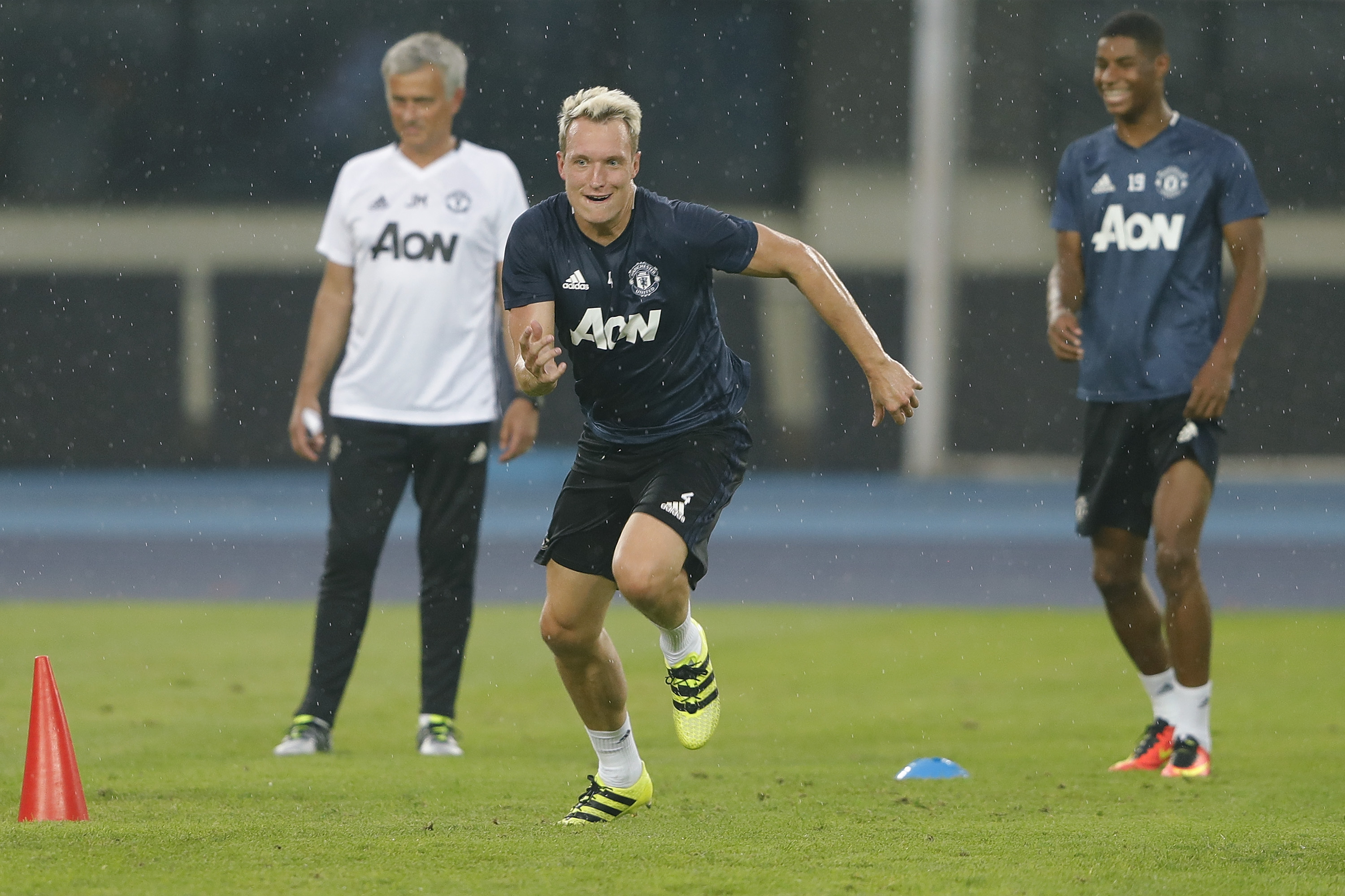 BEIJING, CHINA - JULY 24: Phil Jones of Manchester United in action  during the team training session for the 2016 International Champions Cup match between Manchester City and Manchester United at Olympic Sports Center Stadium on July 24, 2016 in Beijing, China.  (Photo by Lintao Zhang/Getty Images)