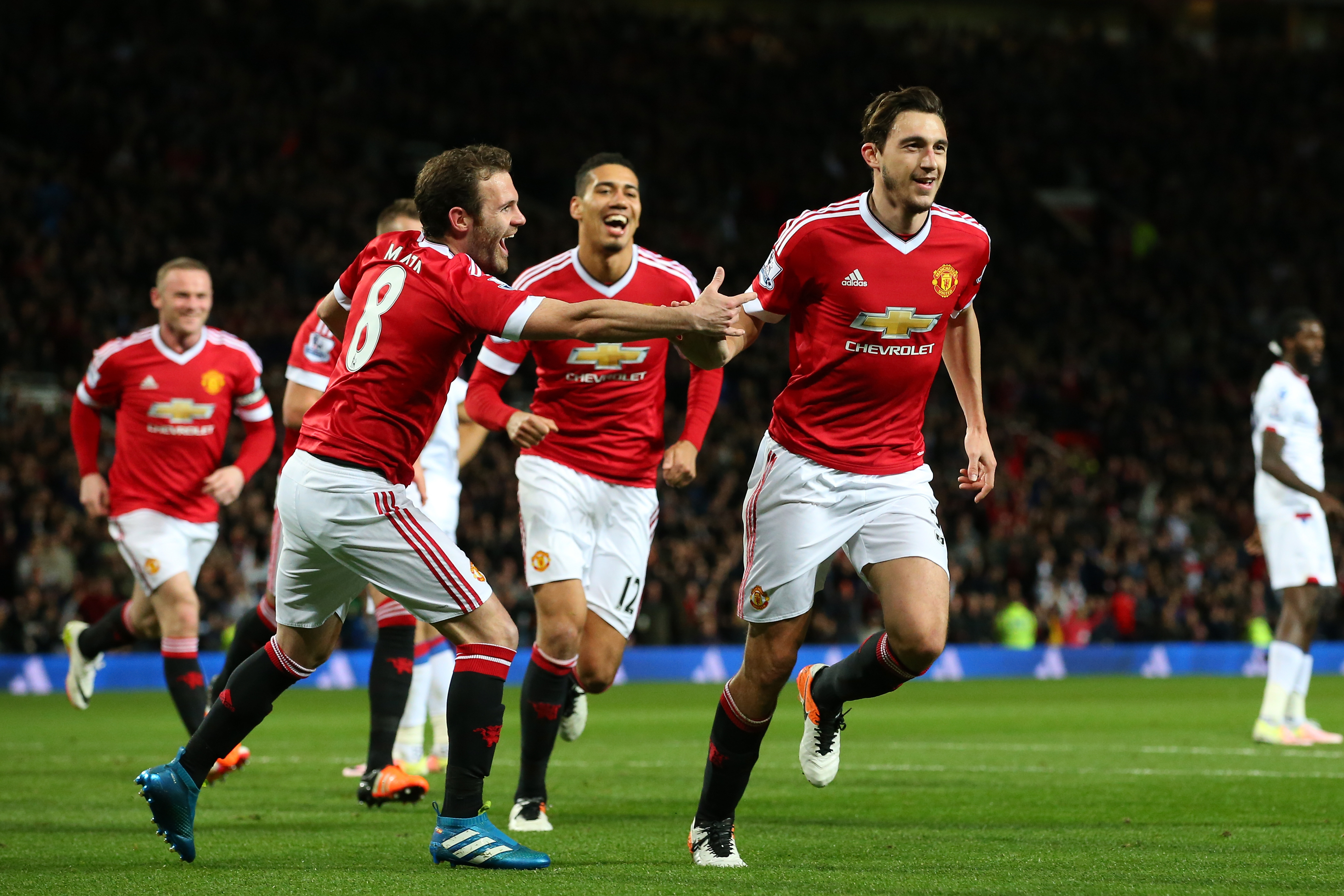 MANCHESTER, ENGLAND - APRIL 20:  Matteo Darmian of Manchester United celebrates with team mates after scoring his sides second goal during the Barclays Premier League match between Manchester United and Crystal Palace at Old Trafford on April 20, 2016 in Manchester, England.  (Photo by Alex Livesey/Getty Images)