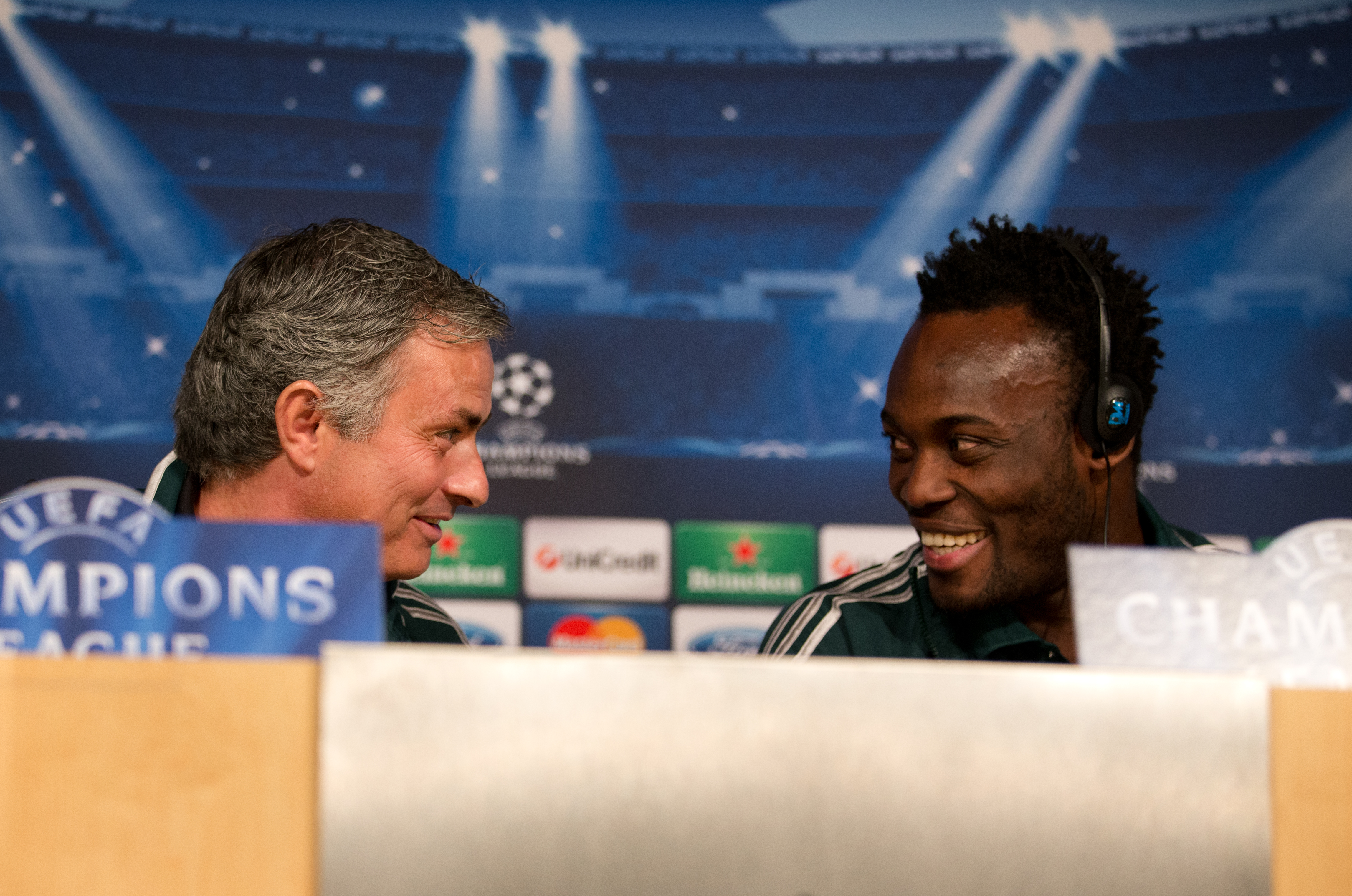 MADRID, SPAIN - FEBRUARY 12:  Head coach Jose Mourinho (L) of Real Madrid chats with his player Michael Essien during a press conference ahead of the UEFA Champions League match between Real Madrid CF and Manchester United at the Valdebebas training ground on February 12, 2013 in Madrid, Spain.  (Photo by Jasper Juinen/Getty Images)