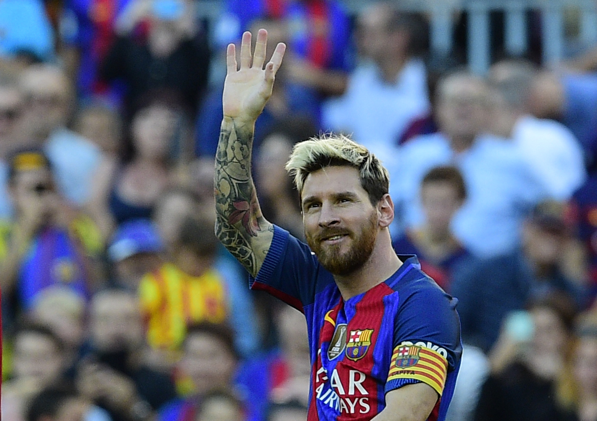 Barcelona's Argentinian forward Lionel Messi celebrates after scoring a goal during the Spanish league football match FC Barcelona vs RC Deportivo de la Coruna at the Camp Nou stadium in Barcelona on October 15, 2016 / AFP / LLUIS GENE        (Photo credit should read LLUIS GENE/AFP/Getty Images)