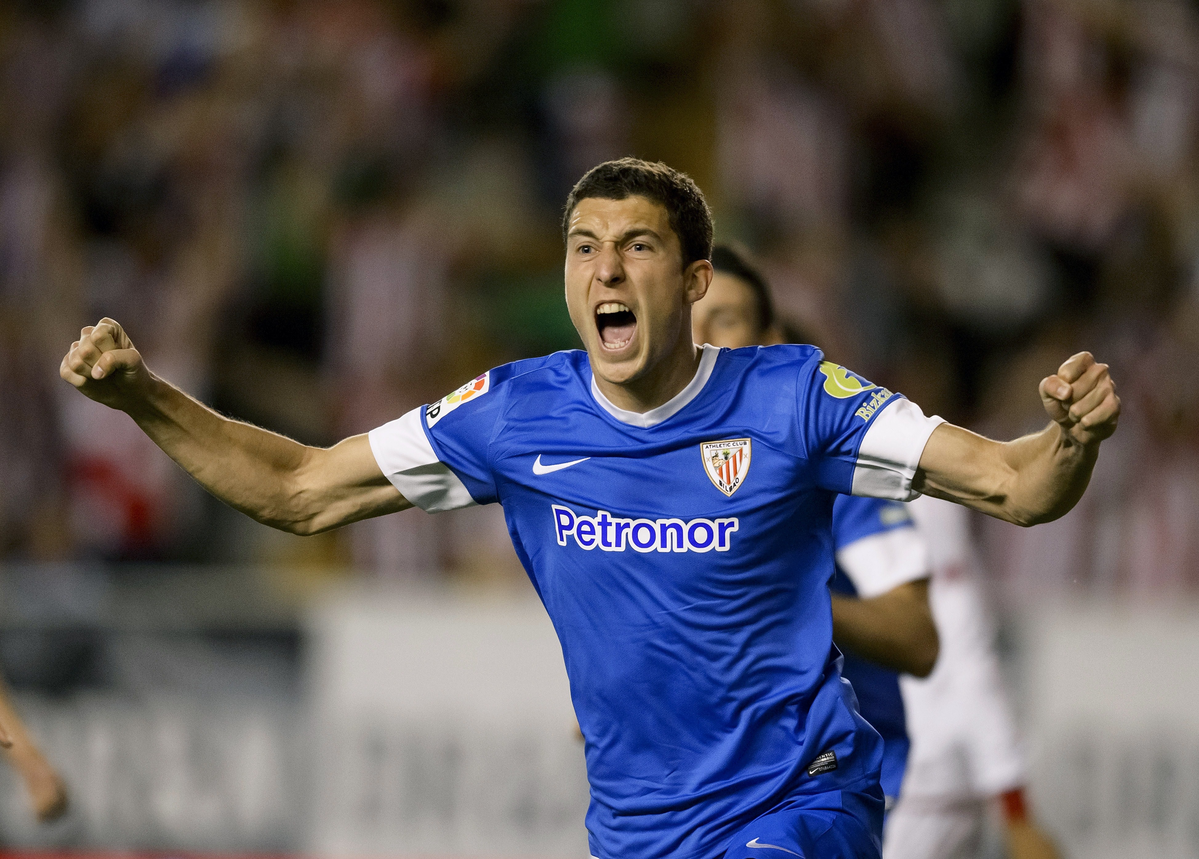 Athletic Bilbao's midfielder Oscar de Marcos celebrates after scoring during the Spanish league football match Rayo Vallecano vs Athletic de Bilbao at the Vallecas stadium in Madrid on May 2, 2014. AFP PHOTO/ DANI POZO        (Photo credit should read DANI POZO/AFP/Getty Images)