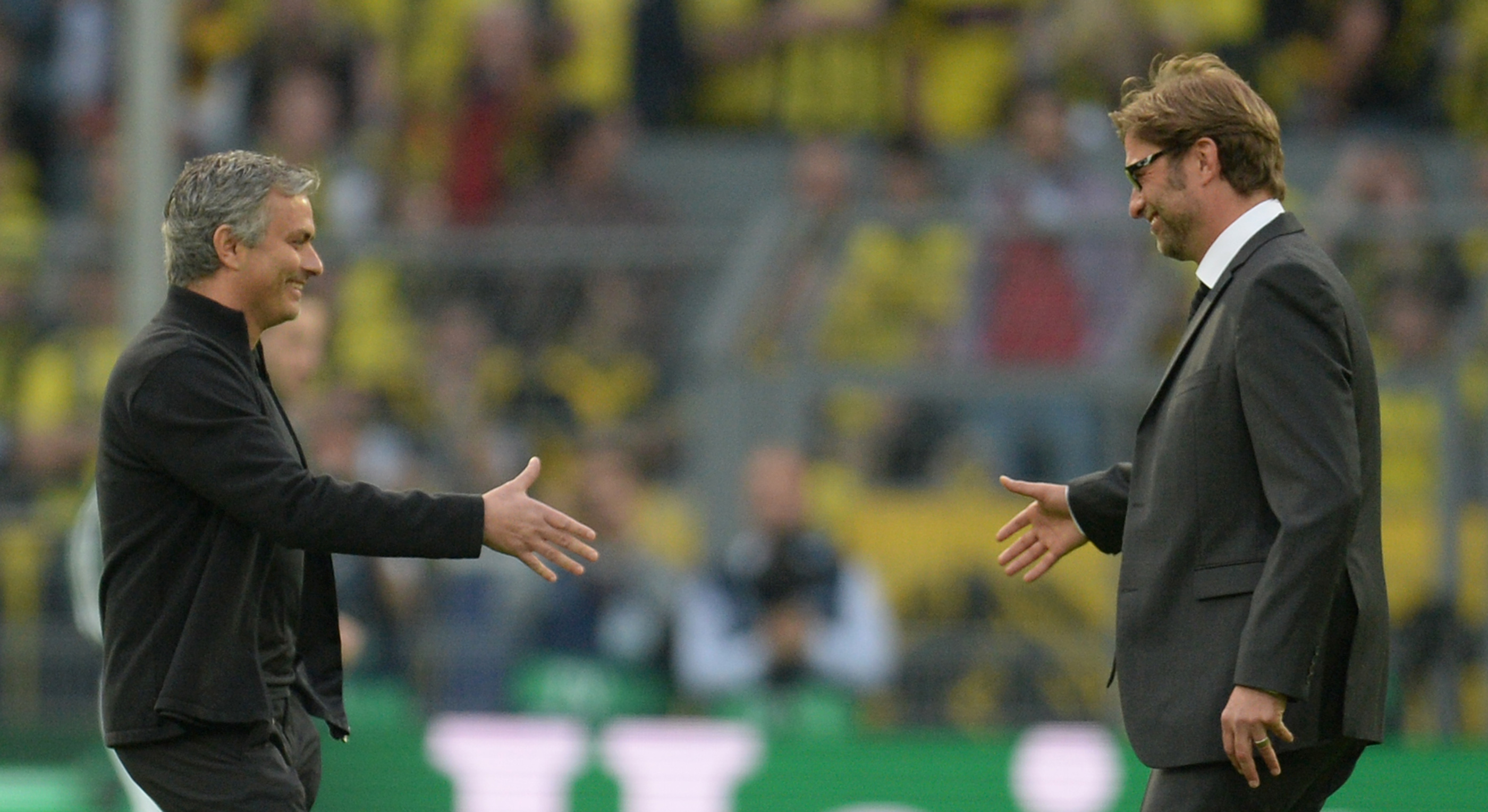 Dortmund's head coach Juergen Klopp (R) shakes hands with Real Madrid's Portuguese coach Jose Mourinho prior to the UEFA Champions League semi final first leg football match between Borussia Dortmund and Real Madrid on April 24, 2013 in Dortmund, western Germany.       (Photo credit: Patrik Stollarz/AFP/Getty Images)