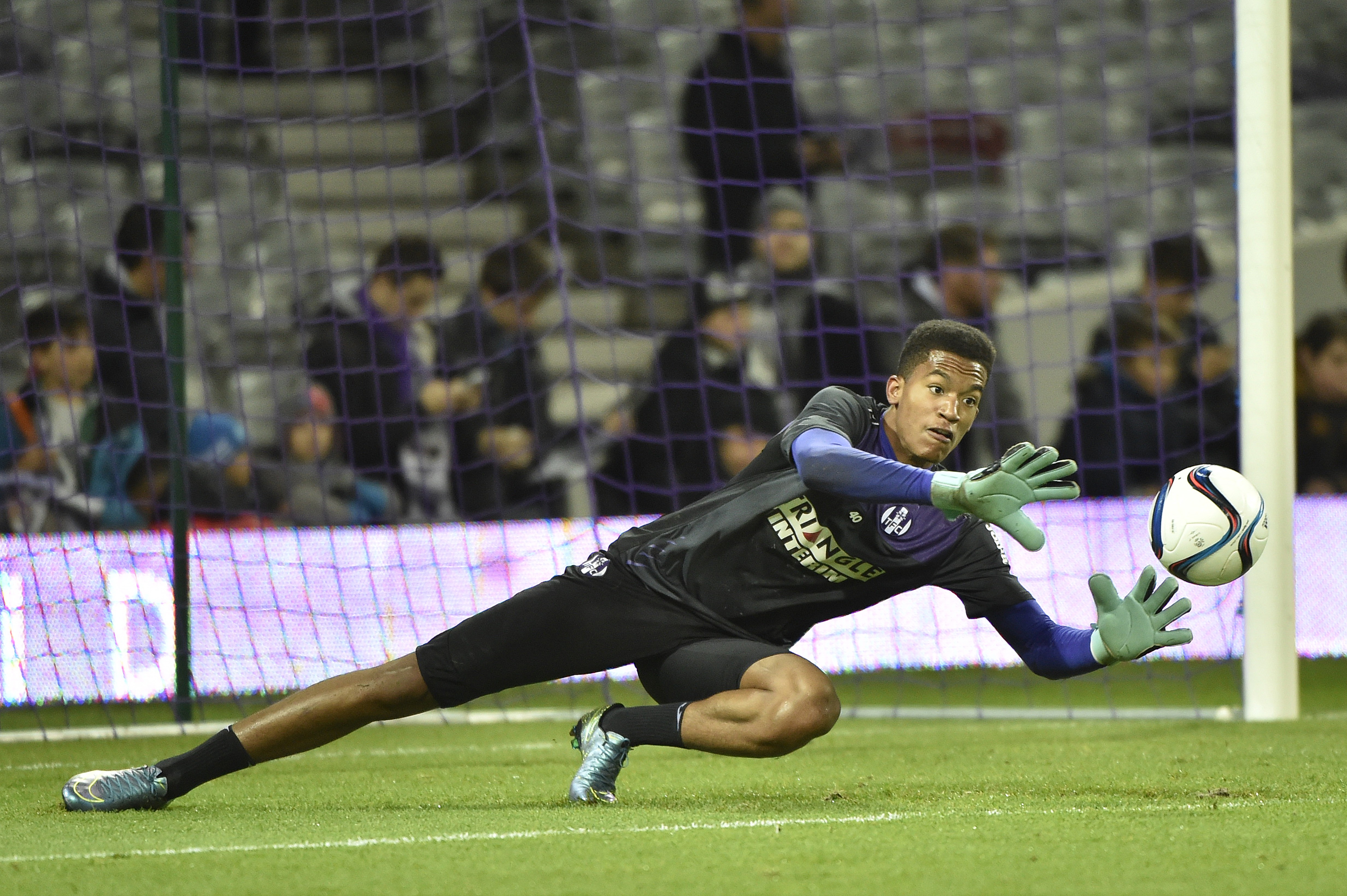 Toulouse's French goalkeeper Alban Lafont warms up before the French L1 football match Toulouse against Lorient on Ddecember 5, 2015 at the Municipal Stadium in Toulouse.  AFP PHOTO /  PASCAL PAVANI / AFP / PASCAL PAVANI        (Photo credit should read PASCAL PAVANI/AFP/Getty Images)