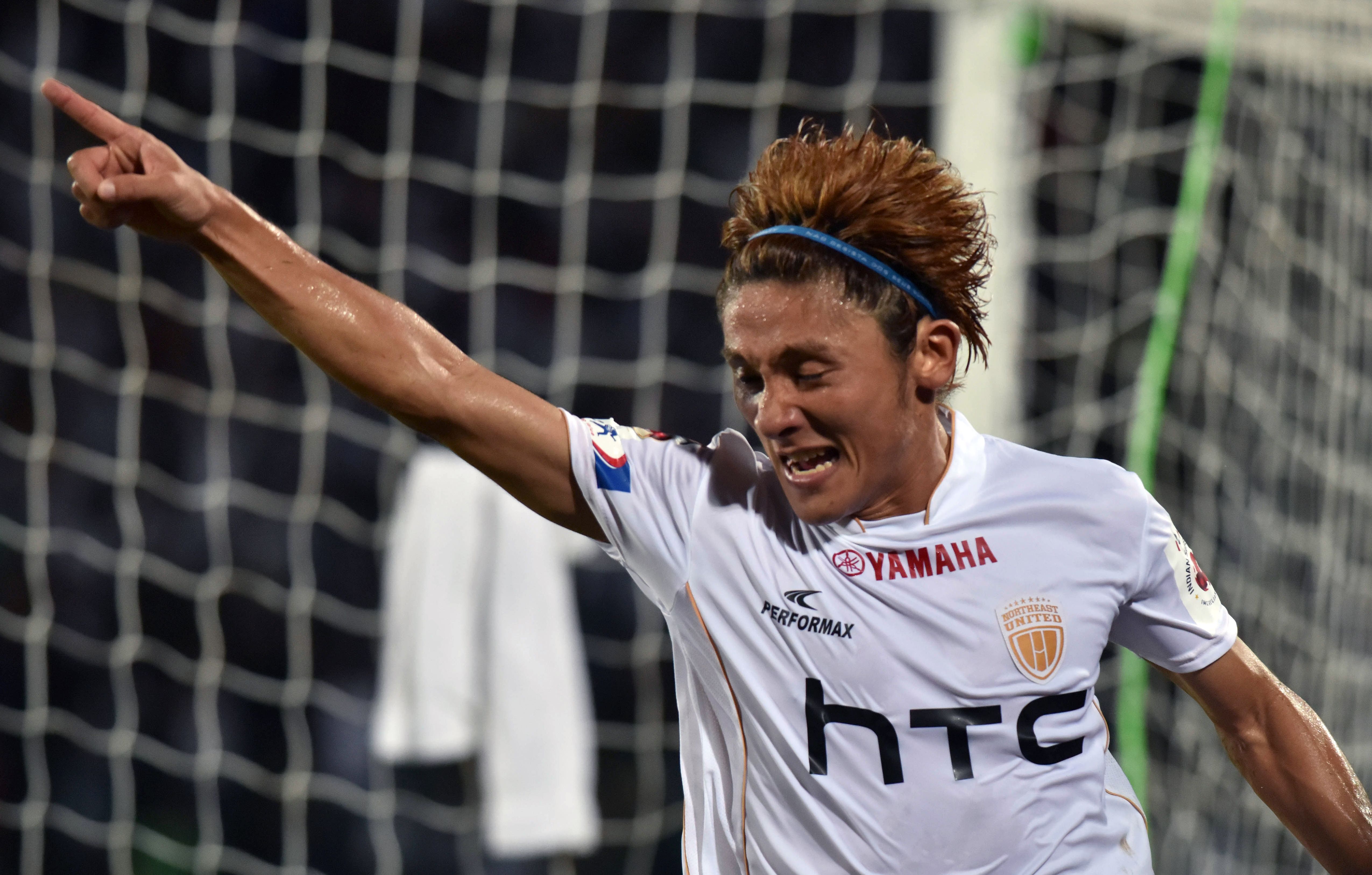 Northeast United FC's midfielder Katsumi Yusa celebrates after scoring a goal during the Indian Super League (ISL) football match between Northeast United FC and Kerala Blasters FC at The Indira Gandhi Athletic Stadium in Guwahati on October 1, 2016. 
----IMAGE RESTRICTED TO EDITORIAL USE - STRICTLY NO COMMERCIAL USE-- / AFP / Biju BORO        (Photo credit should read BIJU BORO/AFP/Getty Images)