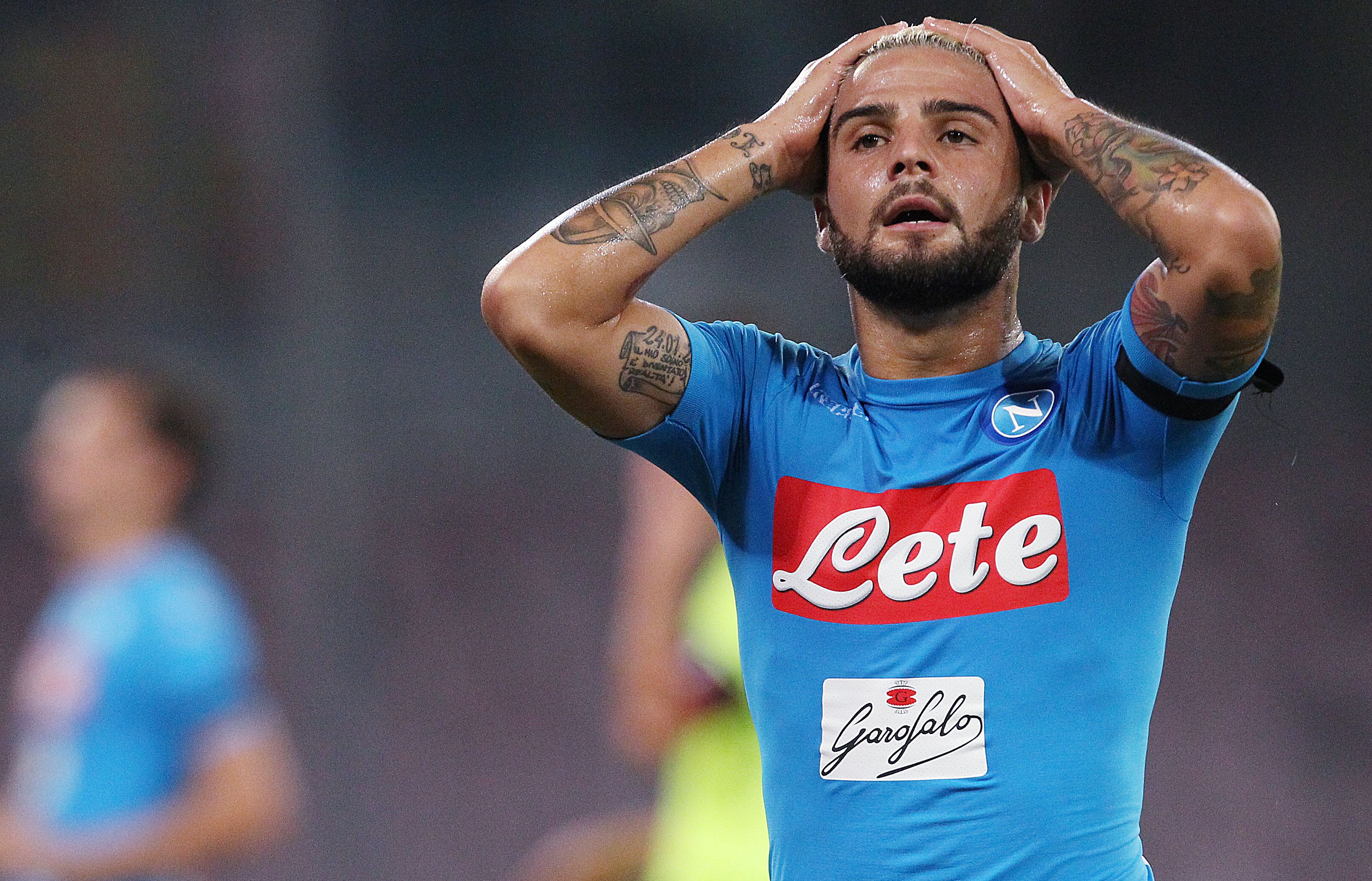 Napoli's Italian forward Lorenzo Insigne reacts after missing a goal during the Italian Serie A football match SSC Napoli vs Bologna FC on September 17 2016 at the San Paolo stadium in Naples. / AFP / CARLO HERMANN        (Photo credit should read CARLO HERMANN/AFP/Getty Images)