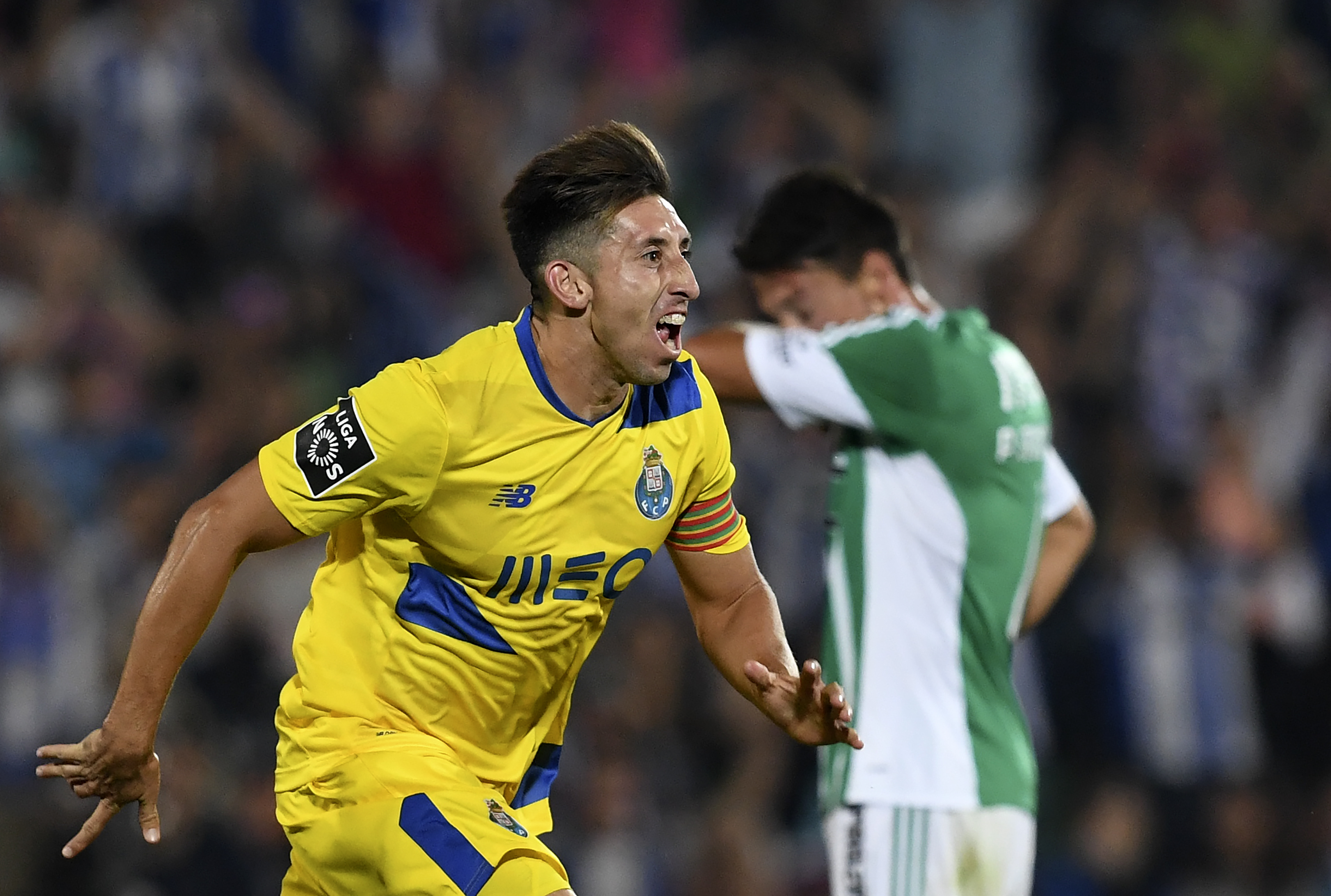 Porto's Mexican midfielder Hector Herrera (L) celebrates after scoring a goal during the Portuguese league football match Rio Ave FC vs SL Benfica at the Dos Arcos stadium in Vila do Conde on August 12, 2016. / AFP / FRANCISCO LEONG        (Photo credit should read FRANCISCO LEONG/AFP/Getty Images)